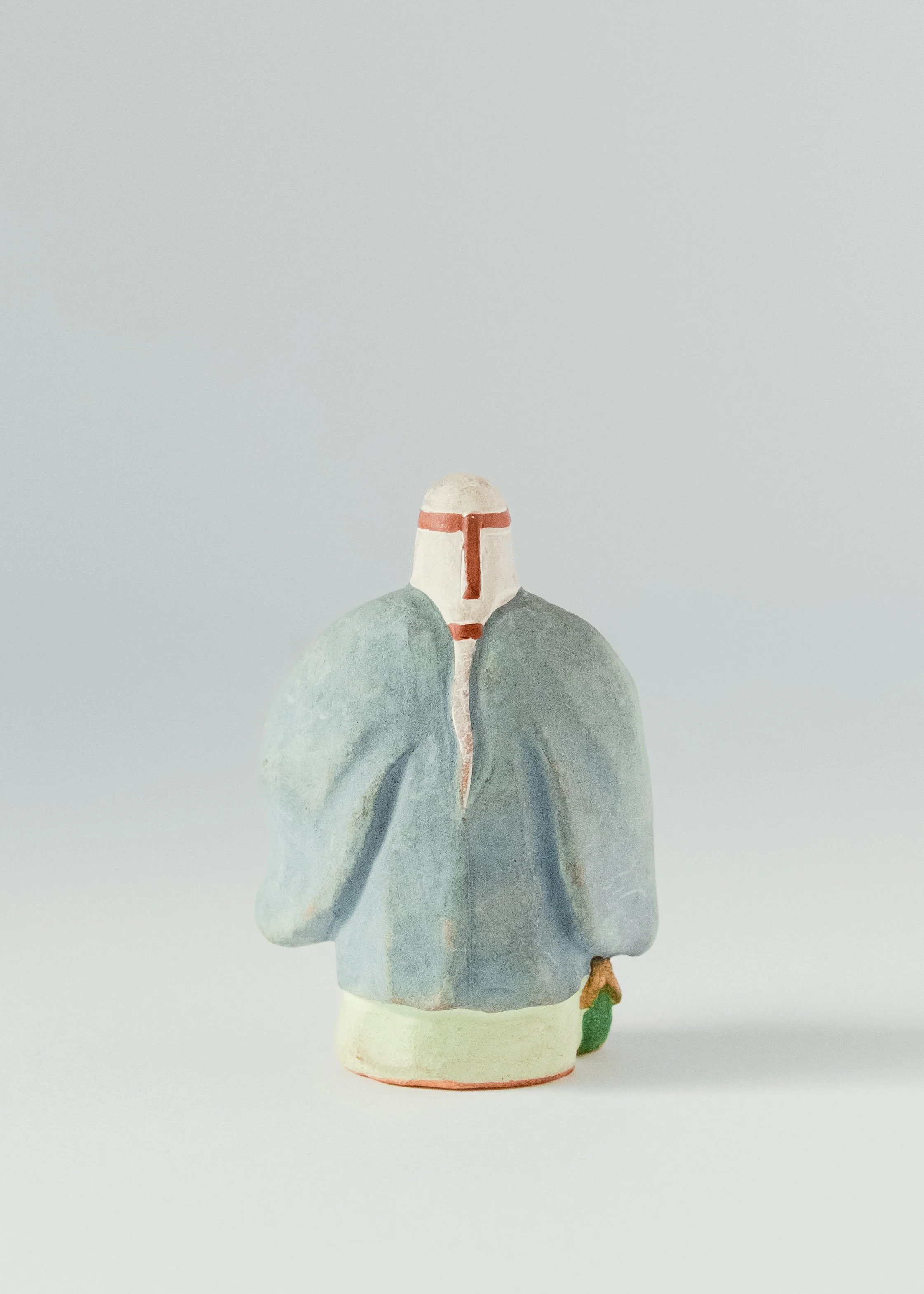 Back view of antique Takasago elder doll wearing traditional kimono showing age wear and patina