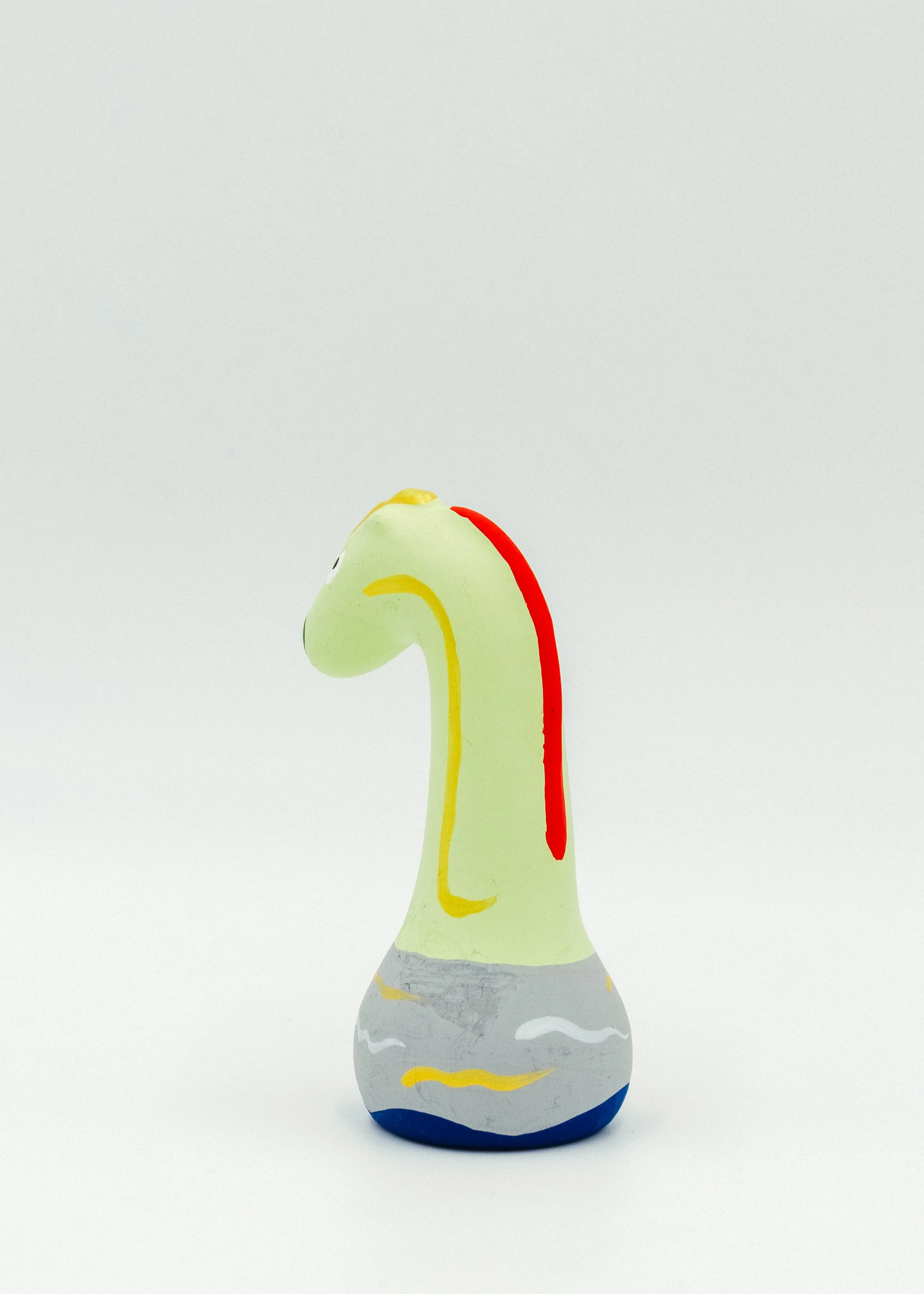 Back view of antique Japanese Obata clay dragon showing traditional painted colors red yellow blue Shiga folk art