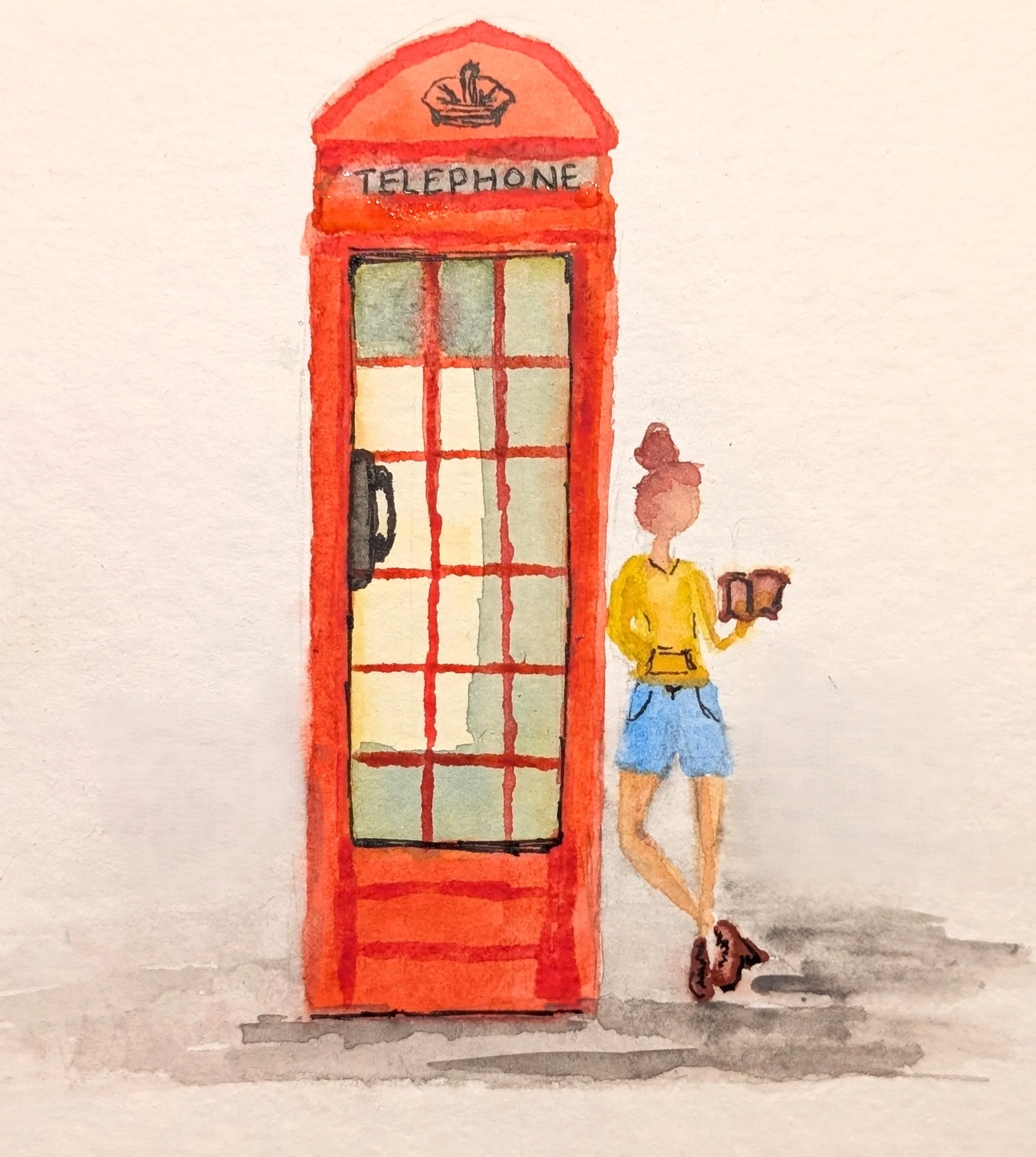 Watercolor painting of a classic red British telephone booth with a person in yellow shirt and blue skirt standing outside holding a cup.