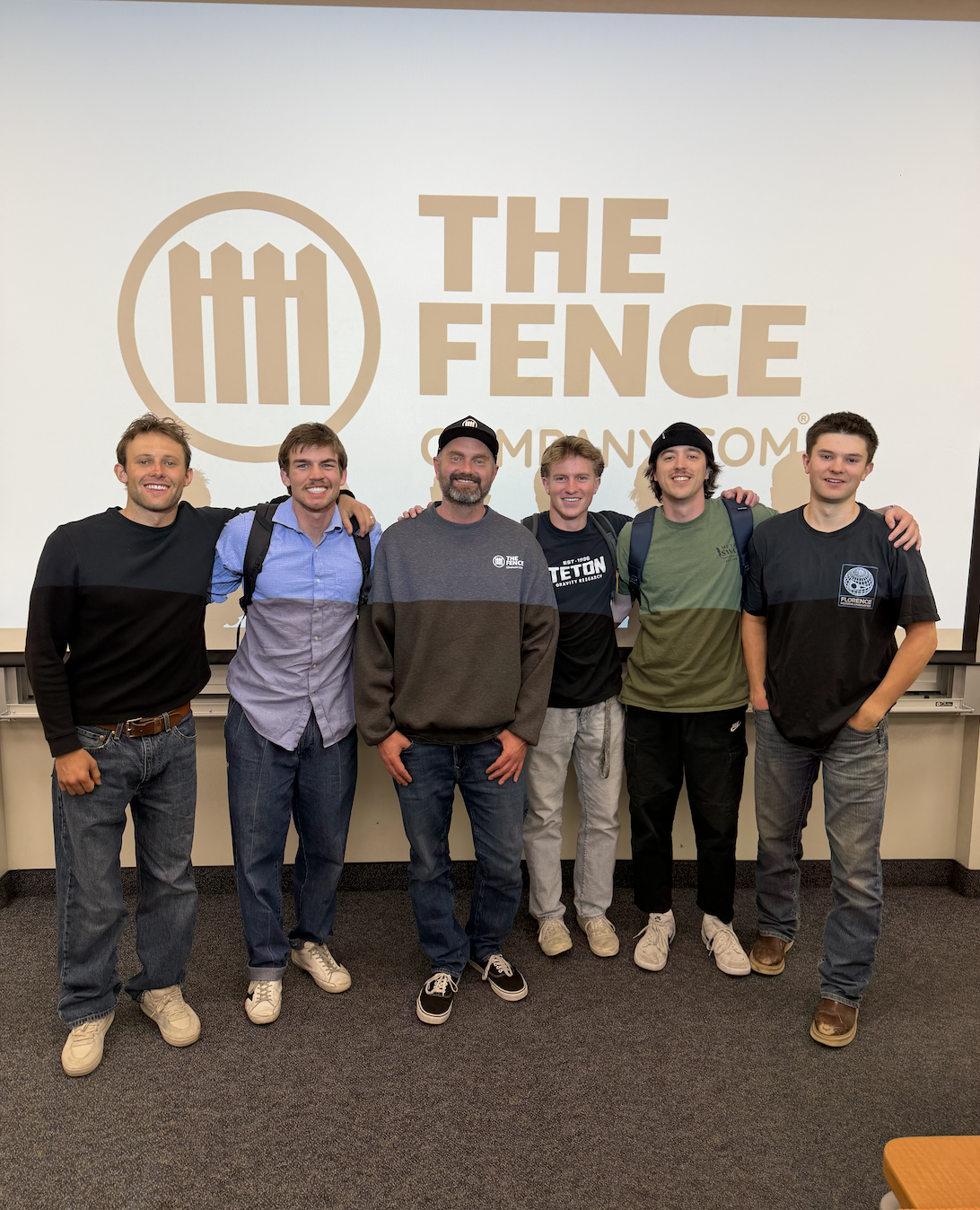 Gavin Murray with members of his BYU construction club and Roger Emmer, owner The Fence Company, during an industry visit