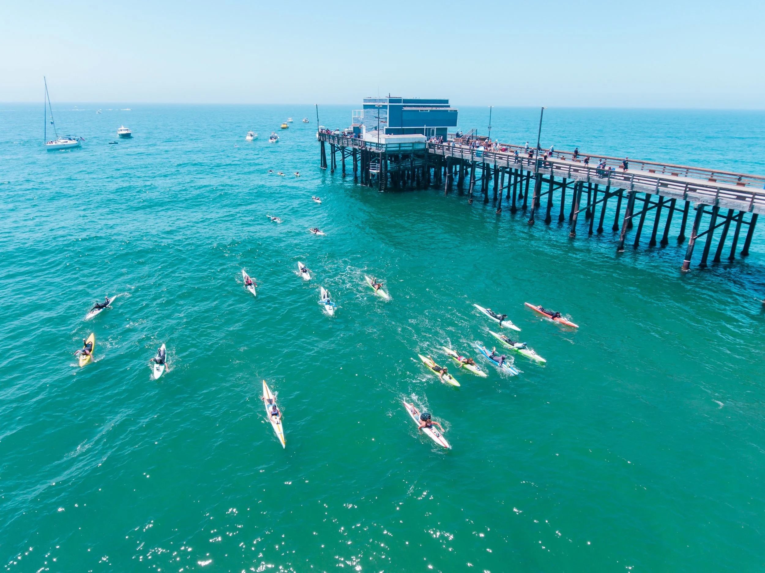Gavin Murray, founder of Frontline Fence, competing in the Ben Carlson Memorial Paddle Out in Newport Beach, California