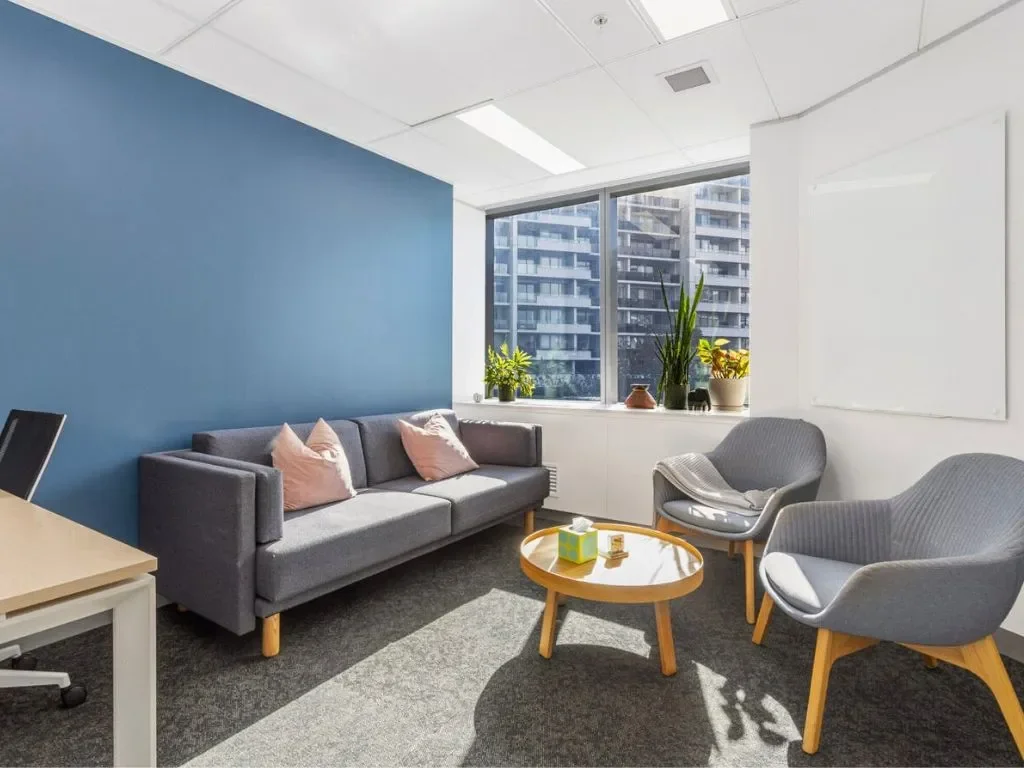 Specialist clinic consultation space at Naia Health St Leonards with seating and city outlook