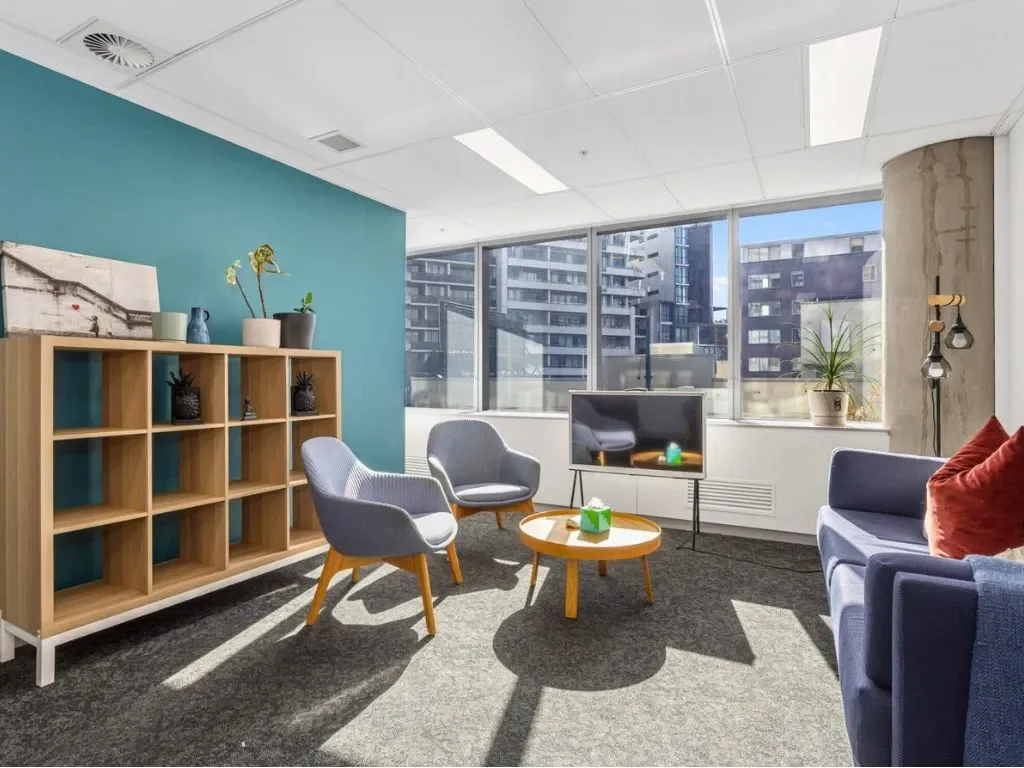 Modern consultation room at Naia Health St Leonards hub with seating area and natural light