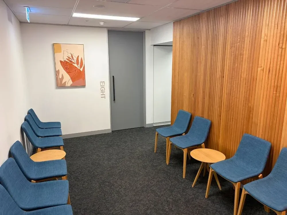 Patient waiting lounge with timber wall