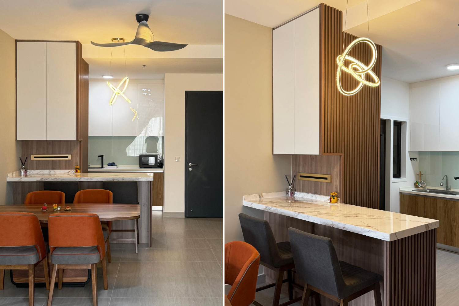 A modern kitchen and dining area with wooden accents, white cabinets, marble countertops, a black door, and contemporary lighting, including a sculptural ceiling fan and an artistic pendant light.