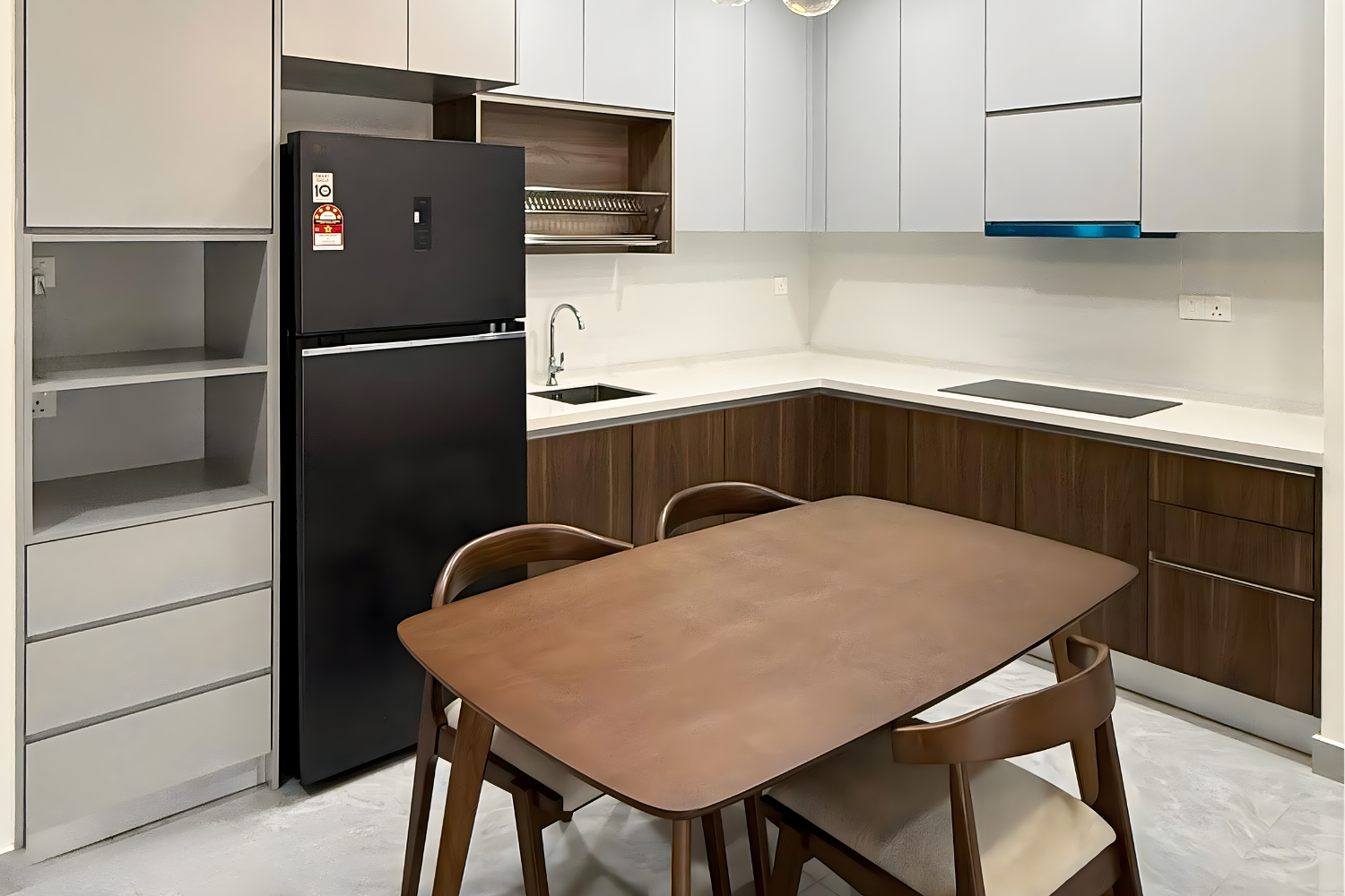 Modern kitchen with wooden and white cabinets, black refrigerator, small sink, electric stove, and dining table with chairs.