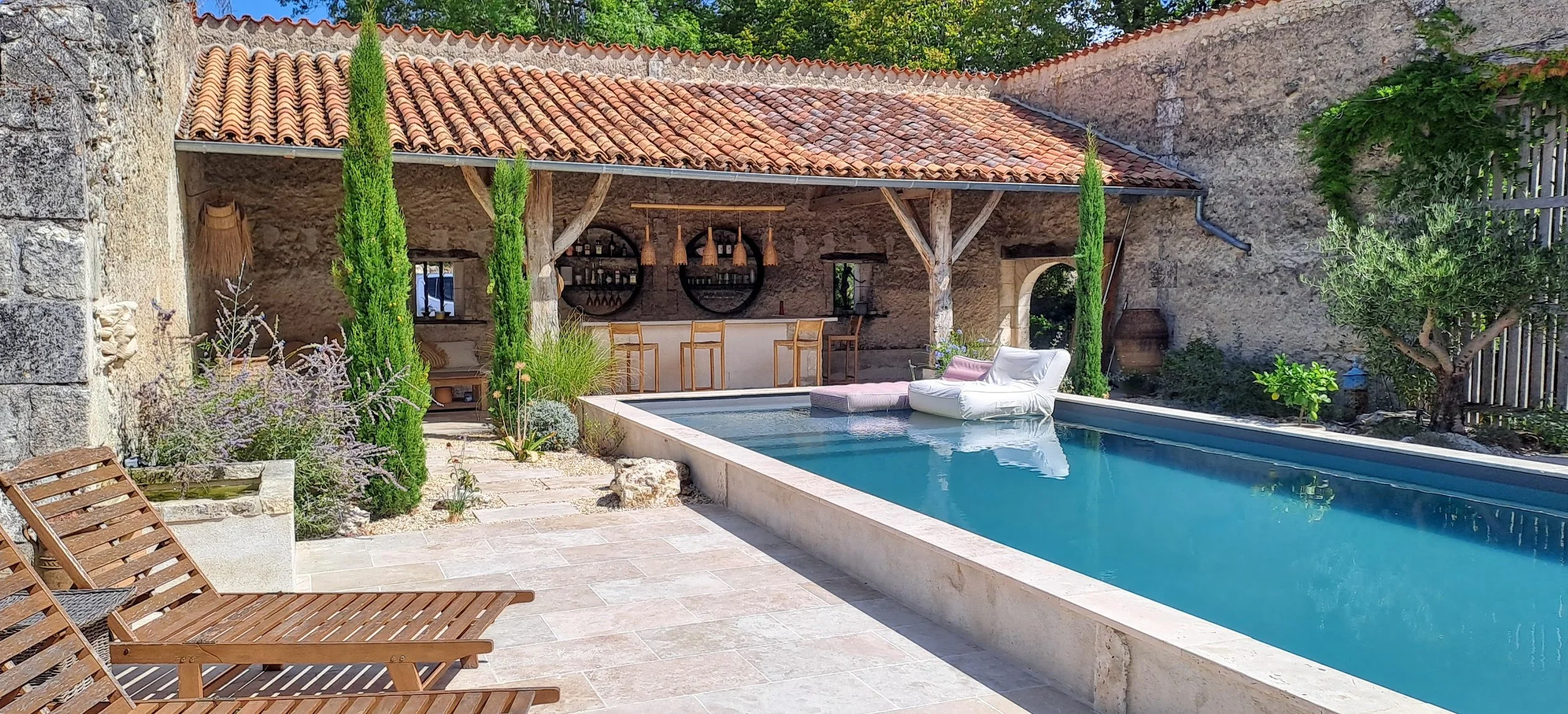 Semi above ground pool inspired by Roman baths