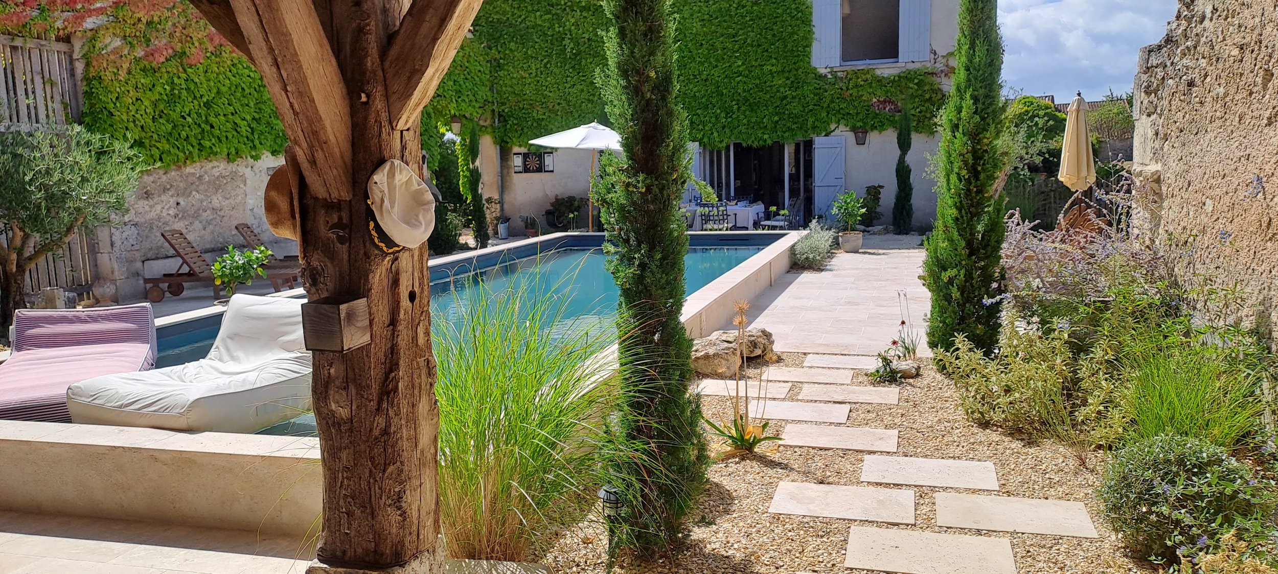 Stone courtyard pool with au vent and planting