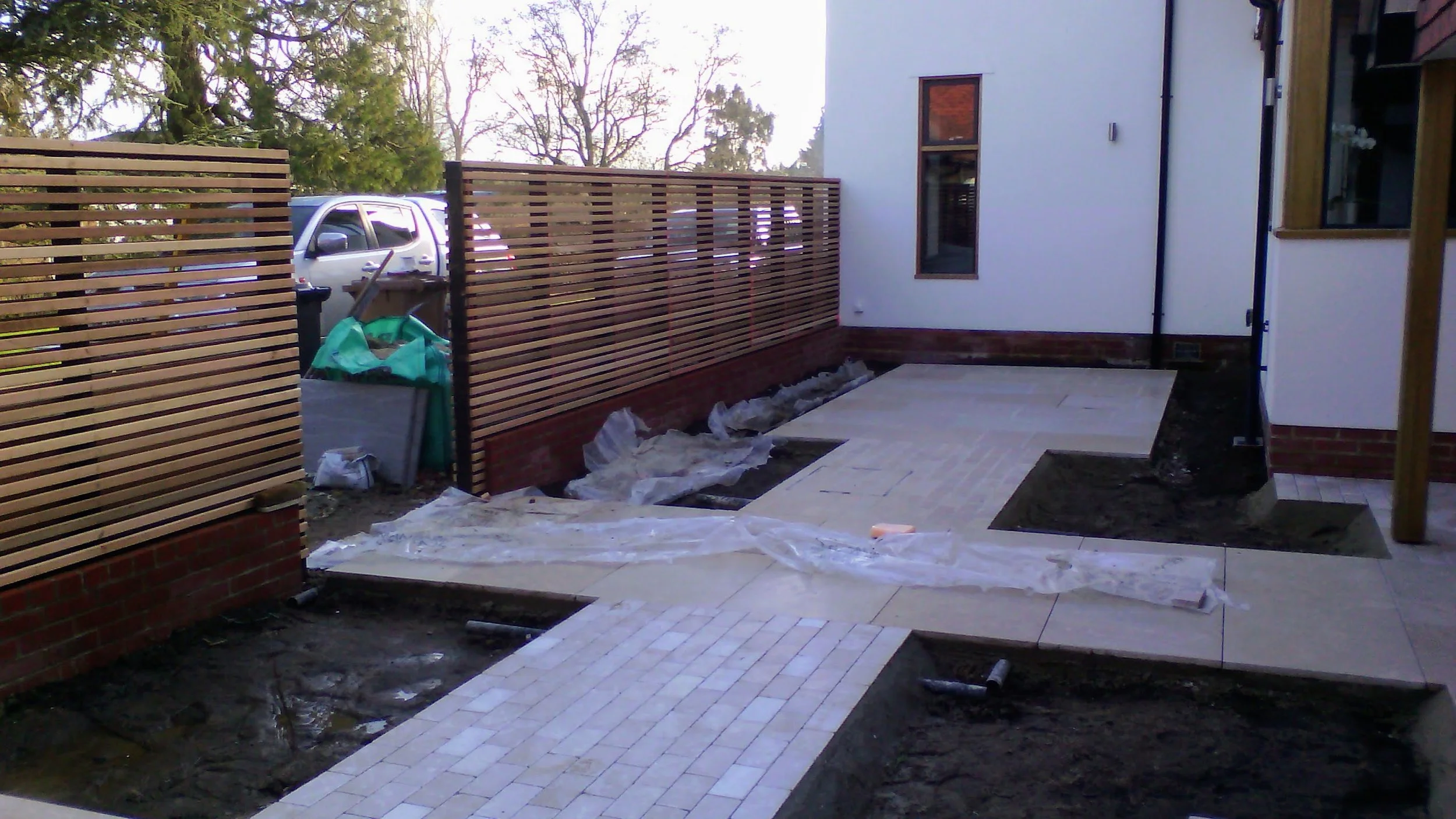 Cedar slatted screen and Limestone paving