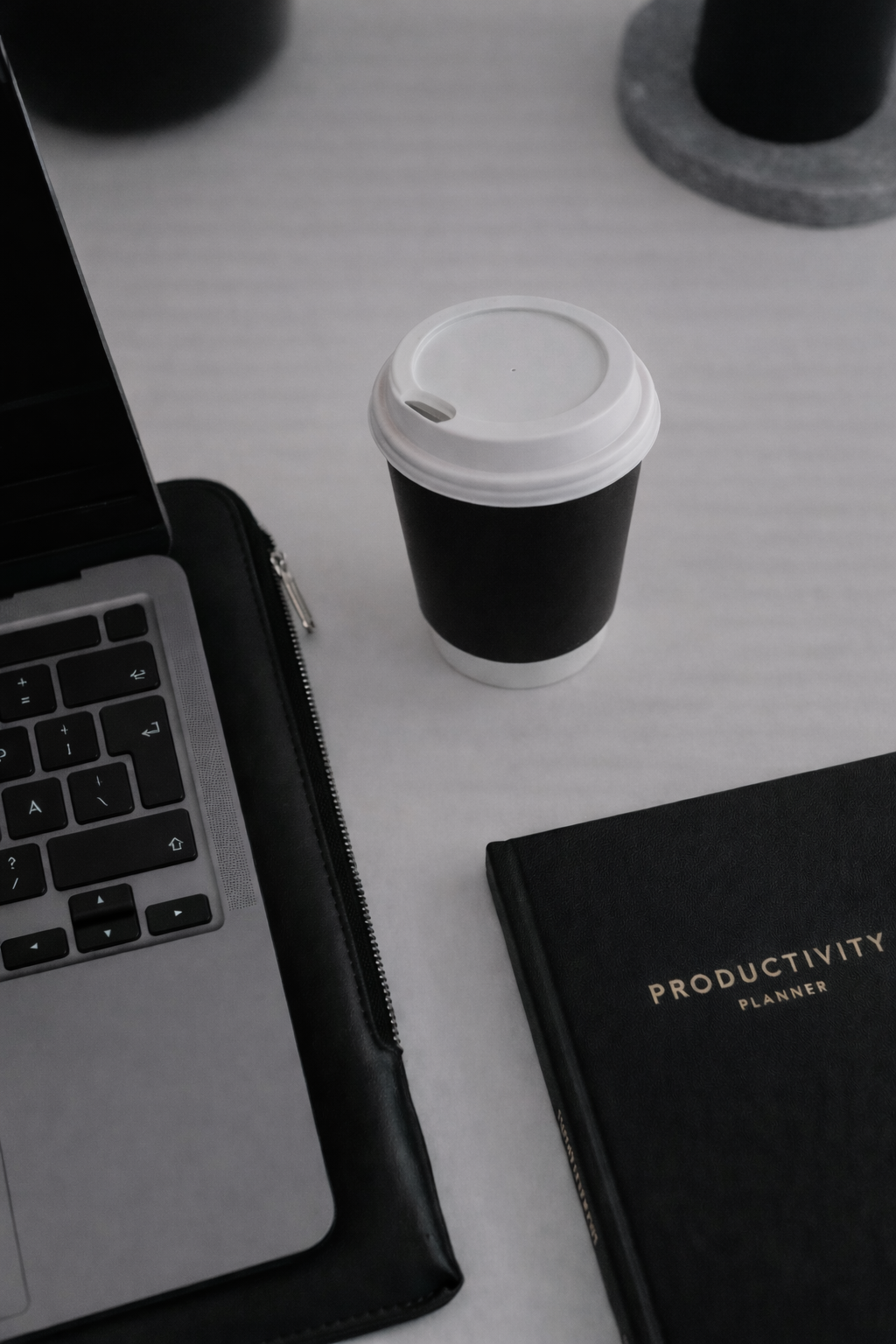 Personal assistant workspace with planner and laptop focused on organisation and productivity