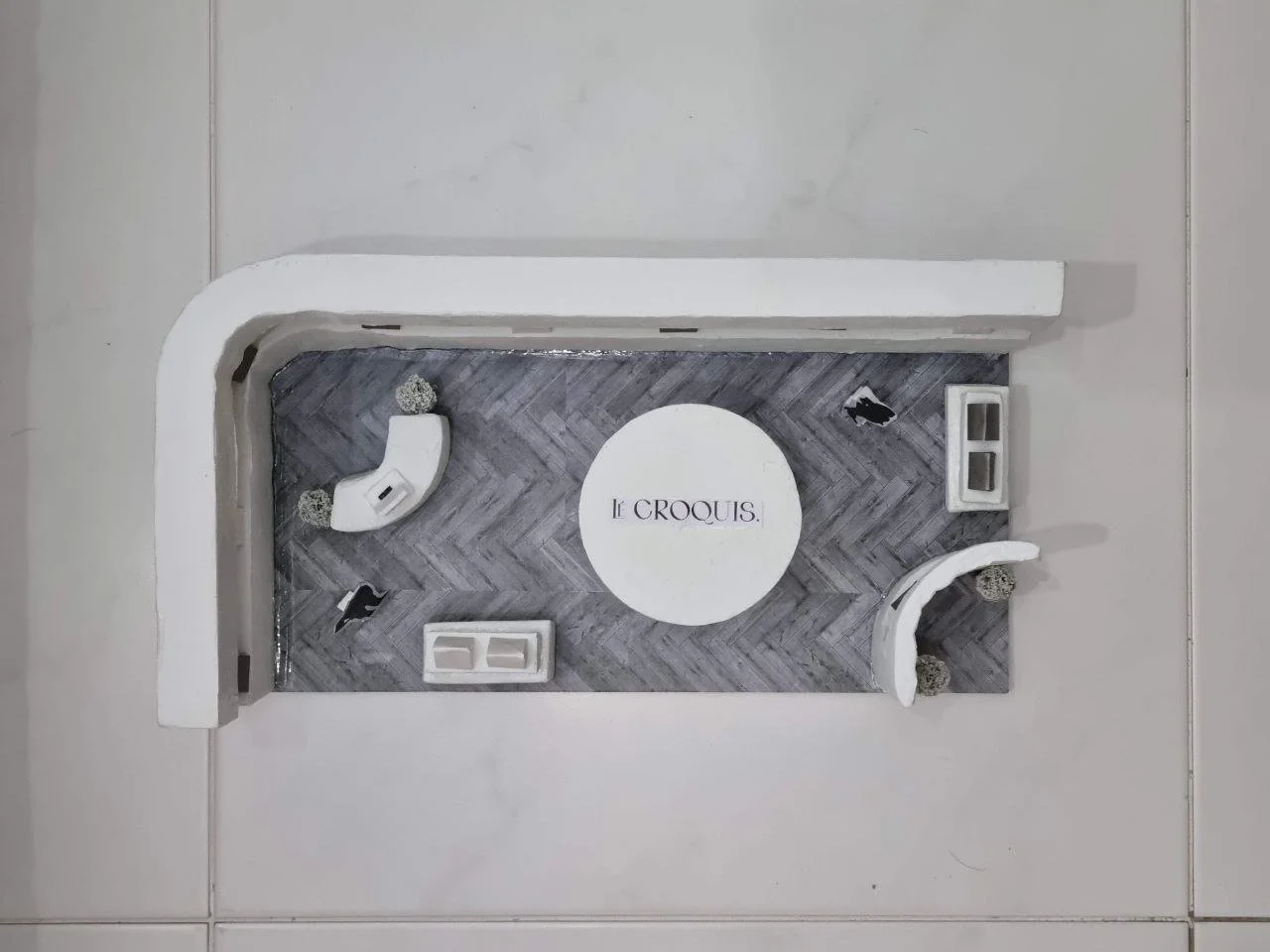 To introduce movement and playfulness within the limited scale of a pop-up, the central display was designed to be rotatable, allowing interaction from multiple angles. The elevated logo placement ensures brand visibility even from other levels, rein