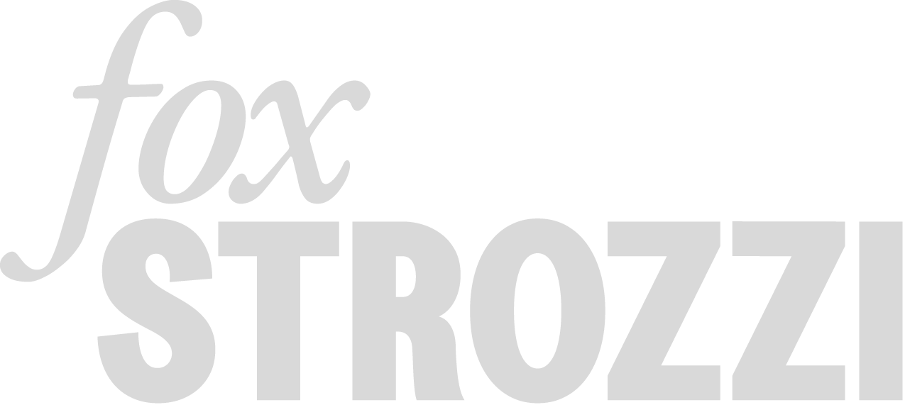 The text "fox STROZZ" in stylized gray font on a black background.