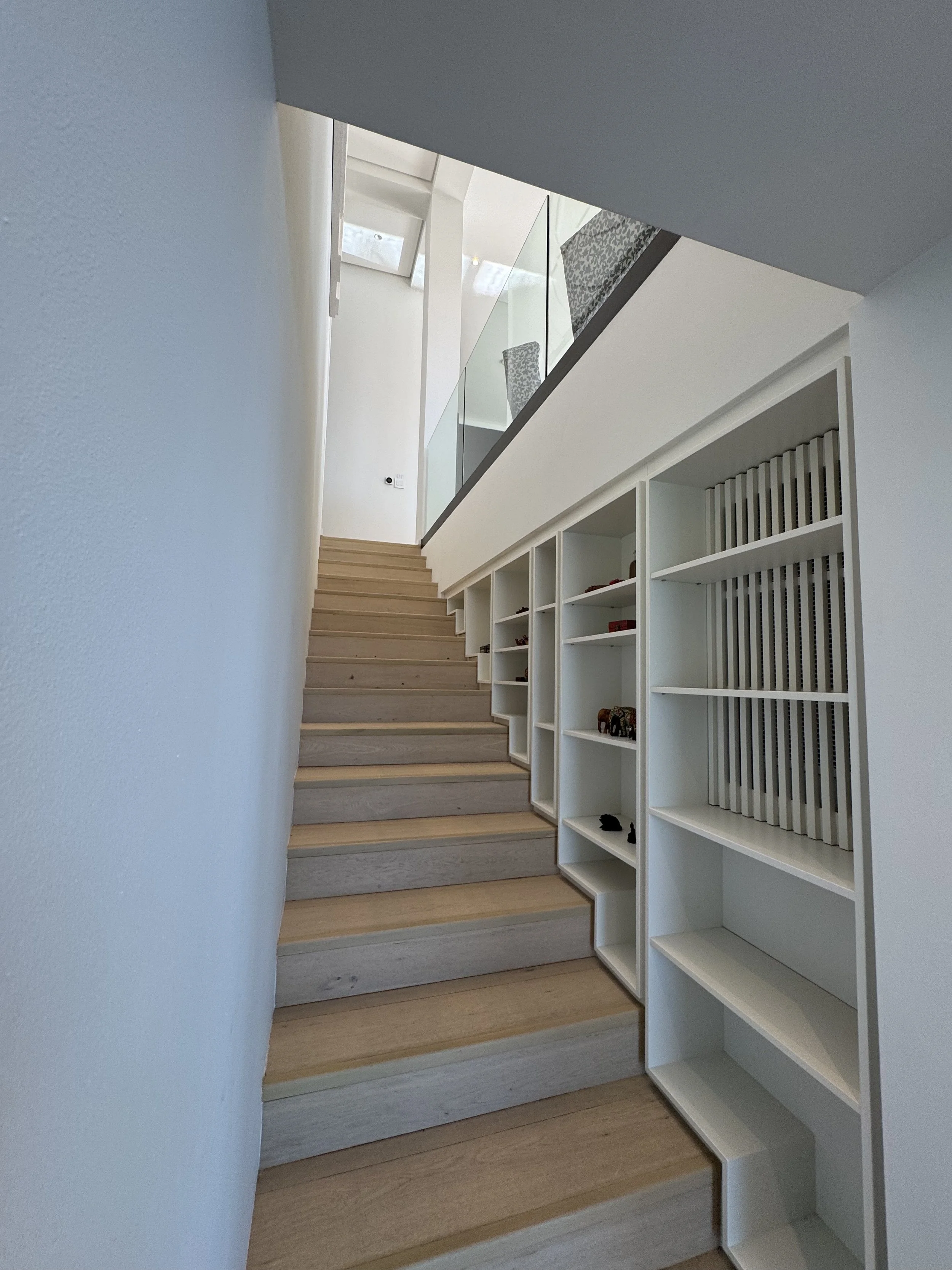 Staircase between Lower & Upper Level