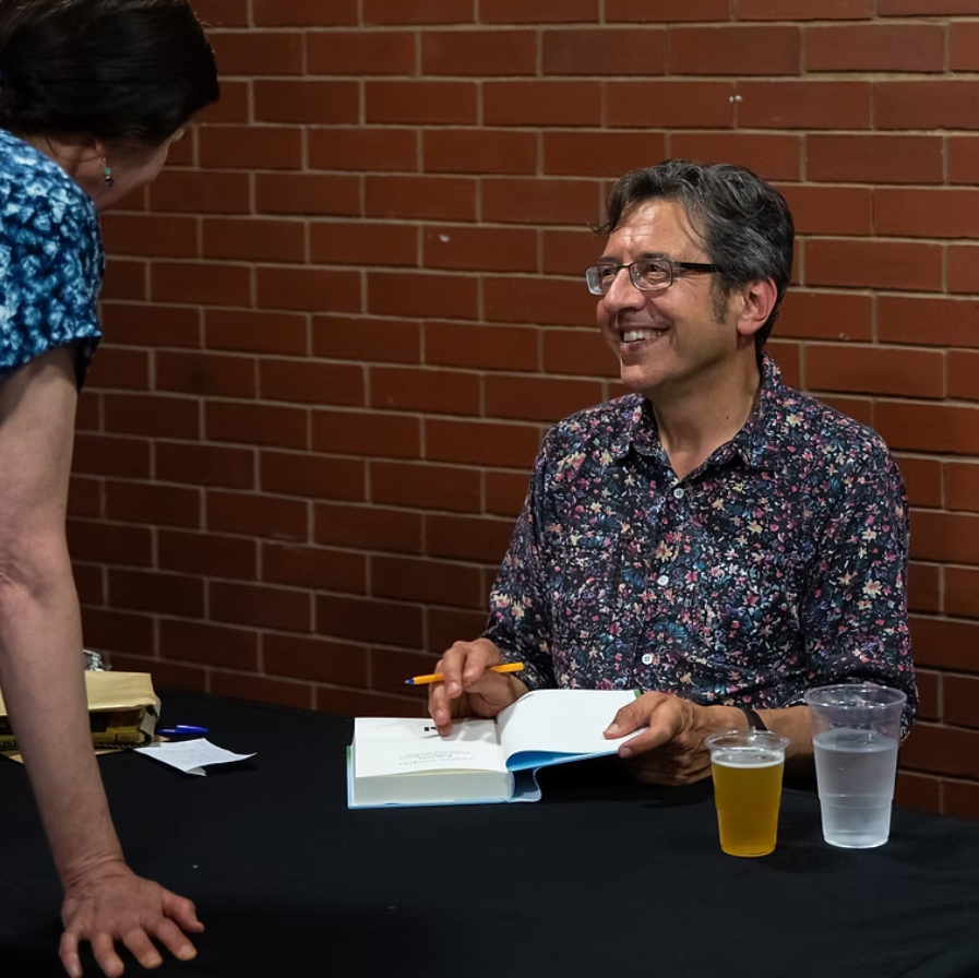 Author signing a book