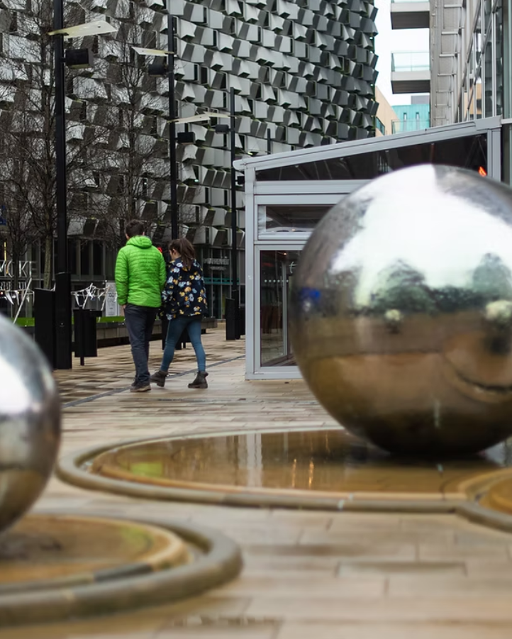 A couple walking in the city centre