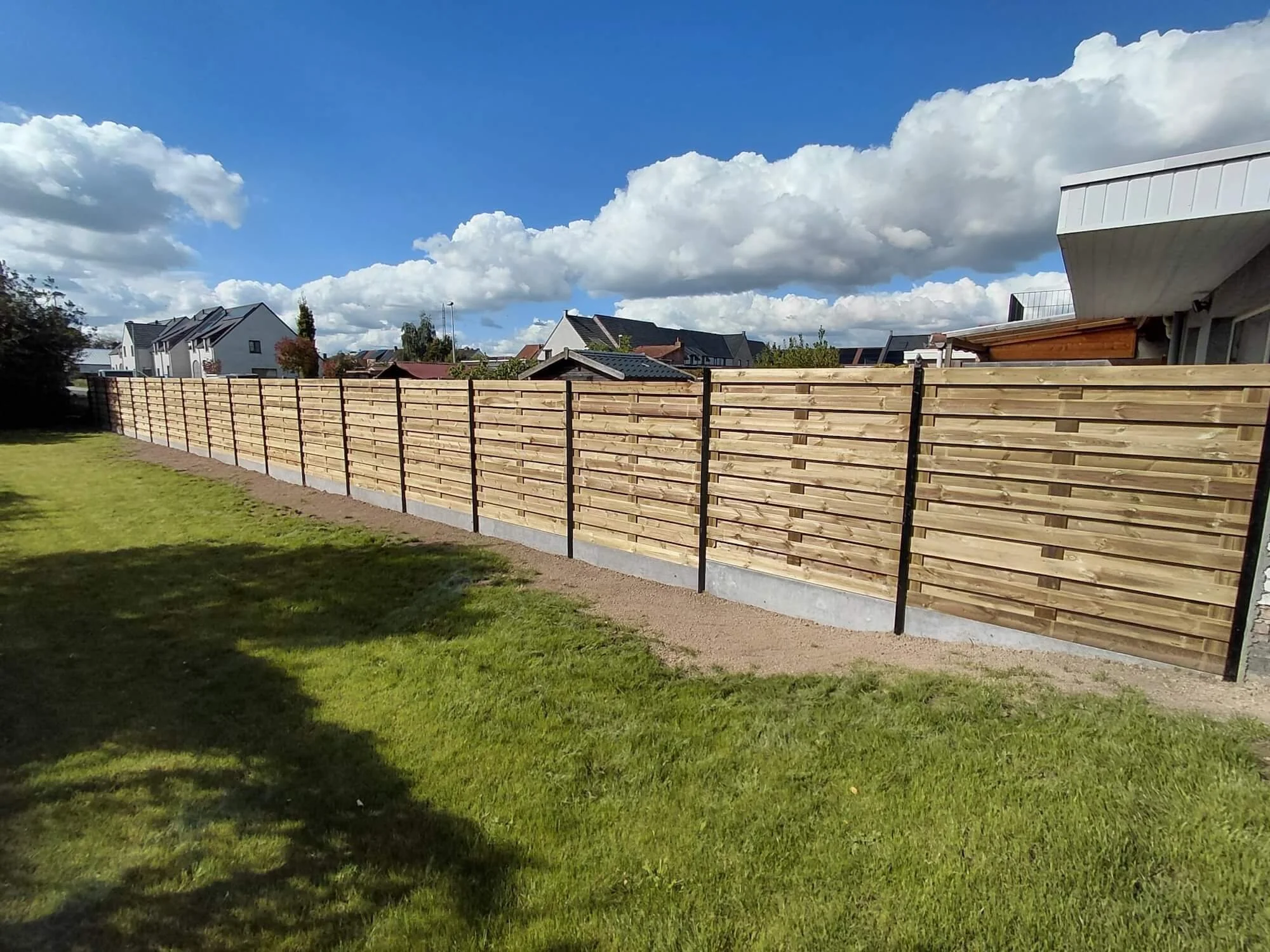 Oranssi technician working on a roof project
