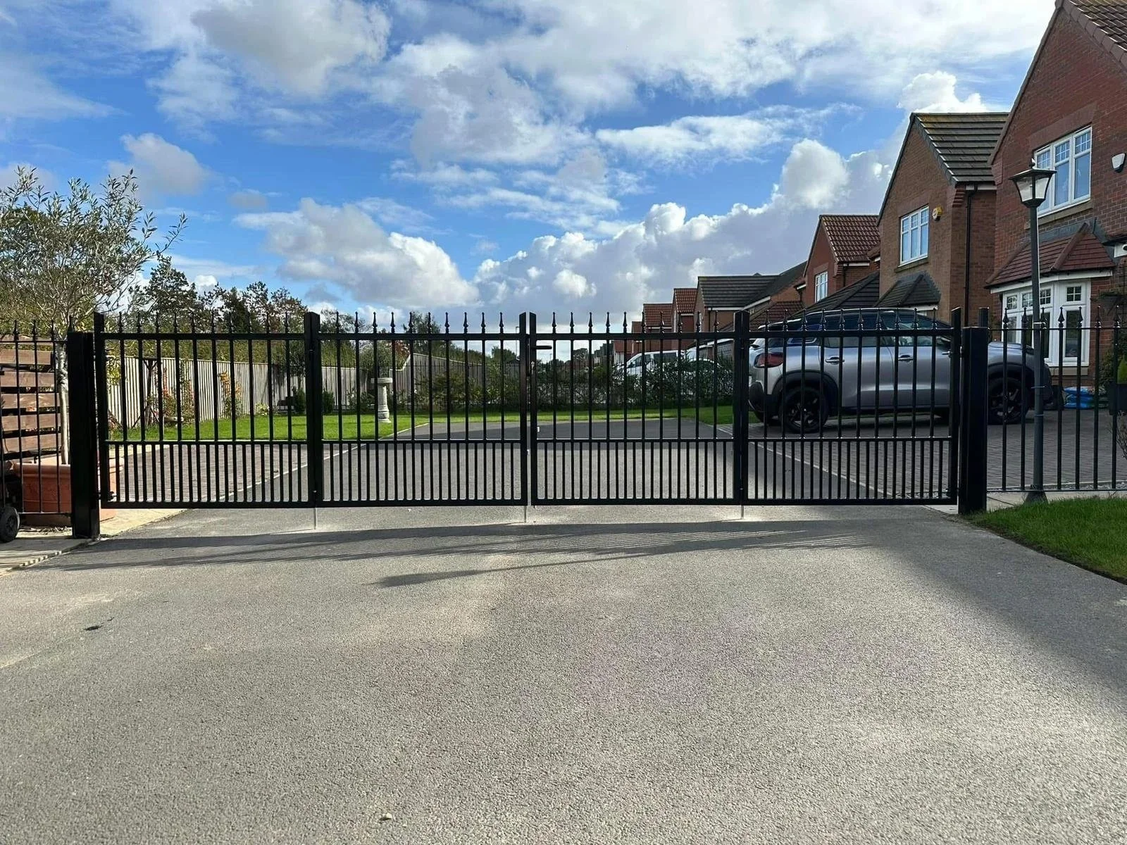 A bespoke iron railing driveway gate, Fabricated & installed by Whitworth Fabrications in Pontefract