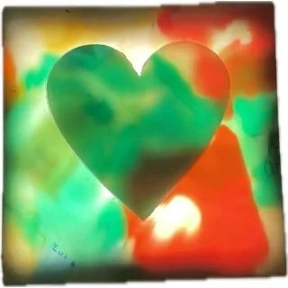 A colorful heart shape with a rainbow-like background.