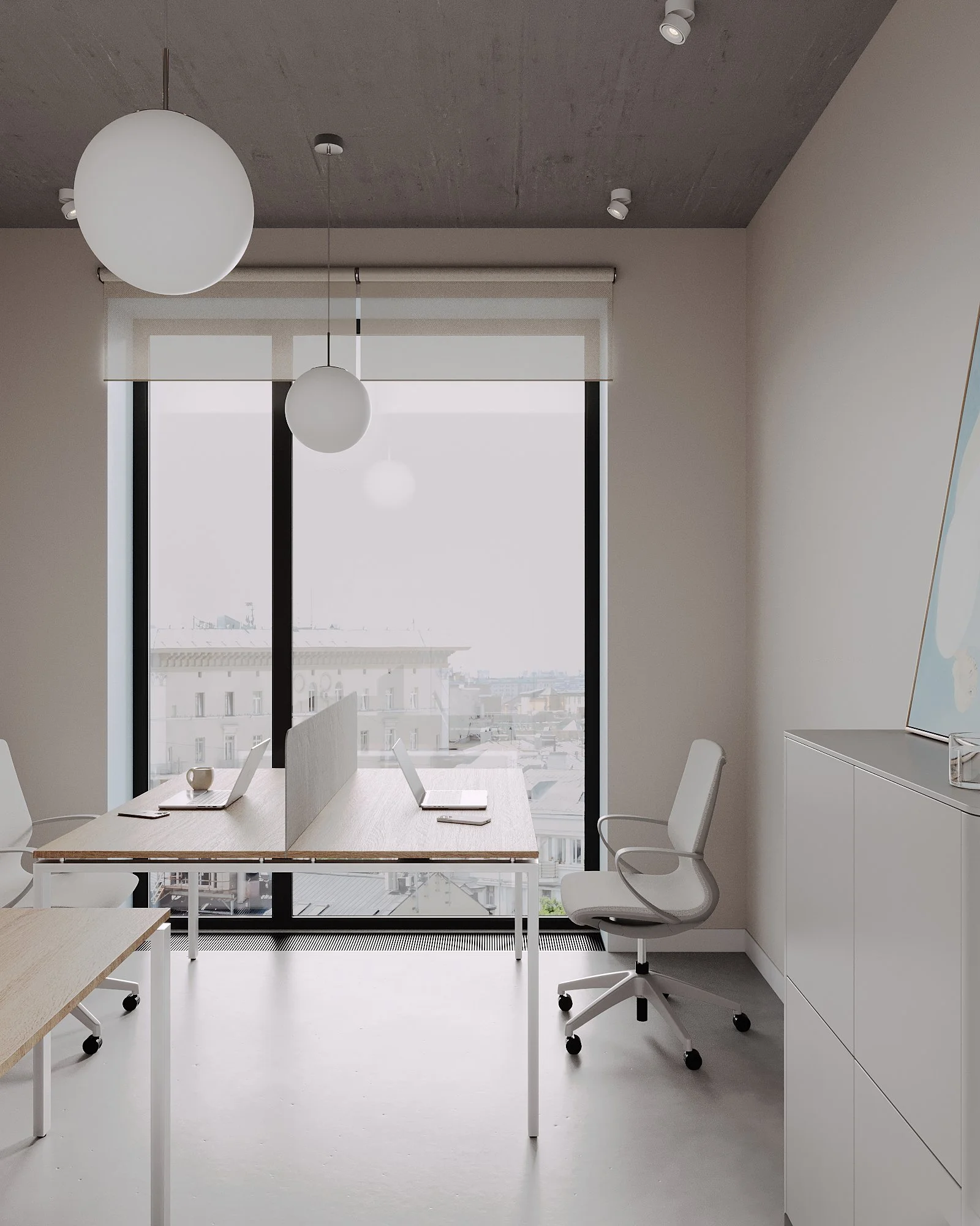 Minimalist modern office with a large window, white cabinets, a white office chair, and a double desk with laptops and a mug.