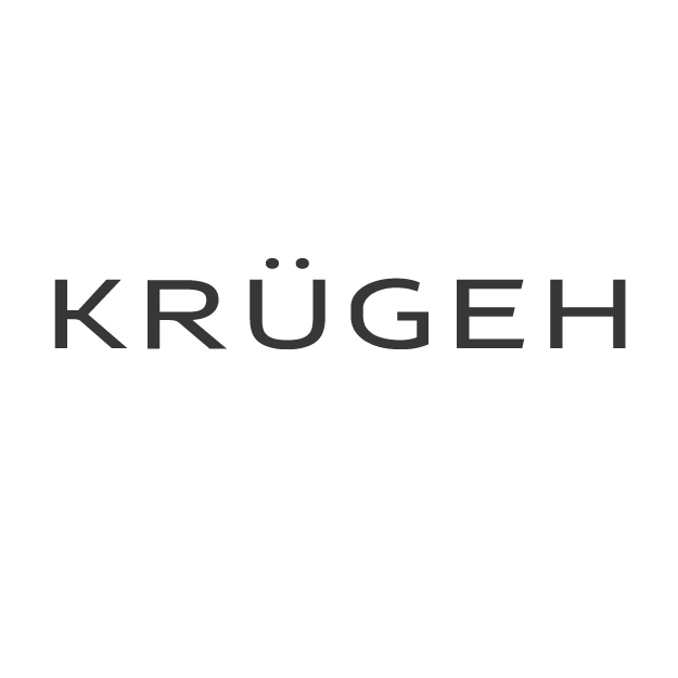 Close-up of a black surface with the word 'KRÜGEH' written in uppercase letters.