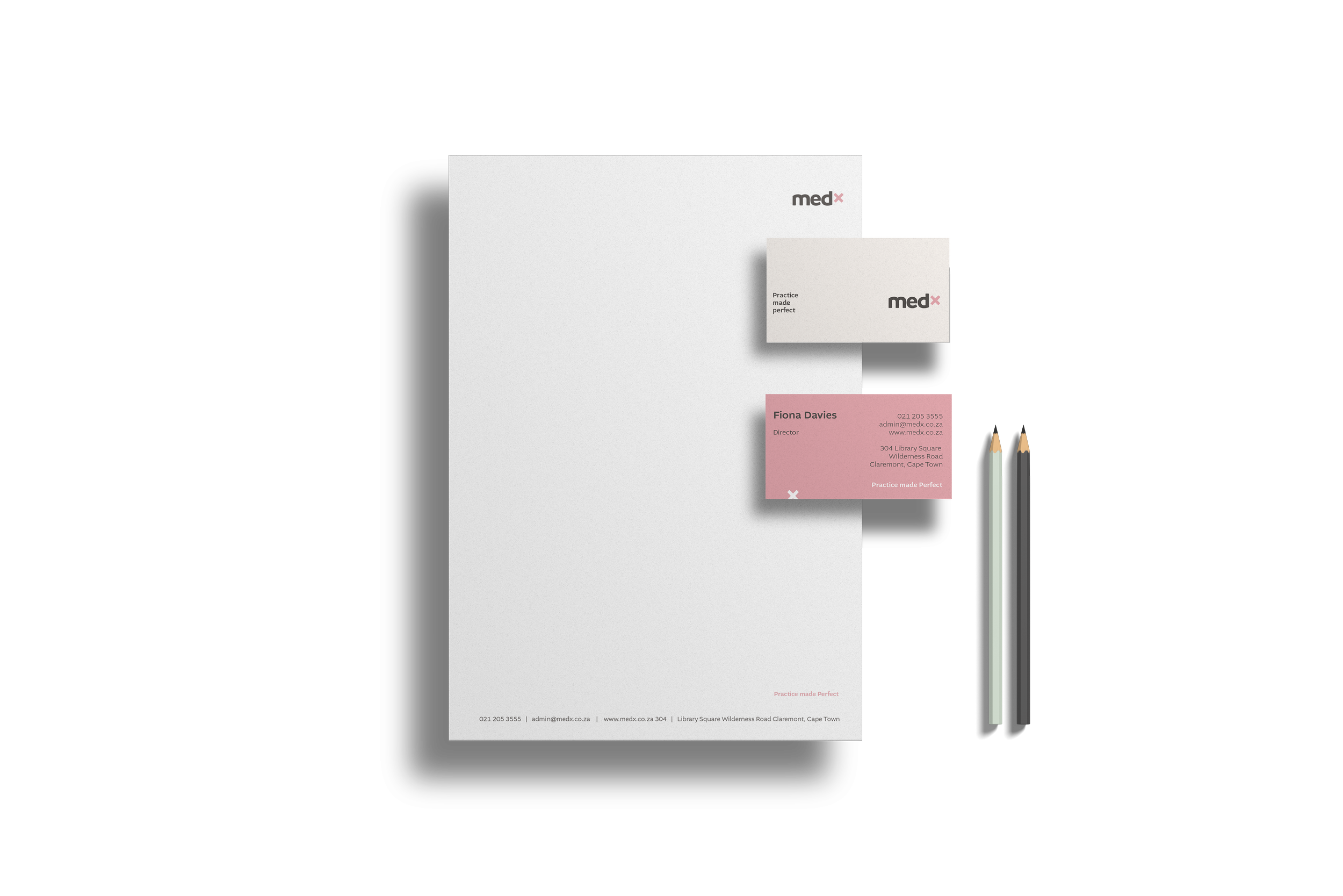 Newly branded MedX corporate stationary with letterhead, business cards and branded pencils in pastel green and medium grey.