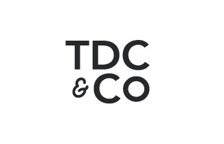 Logo with the text 'TDC & CO' in grey on a white background.