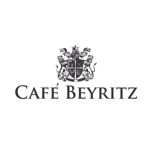 Logo of Cafe Beyritz featuring a crest with two lions and a crown.