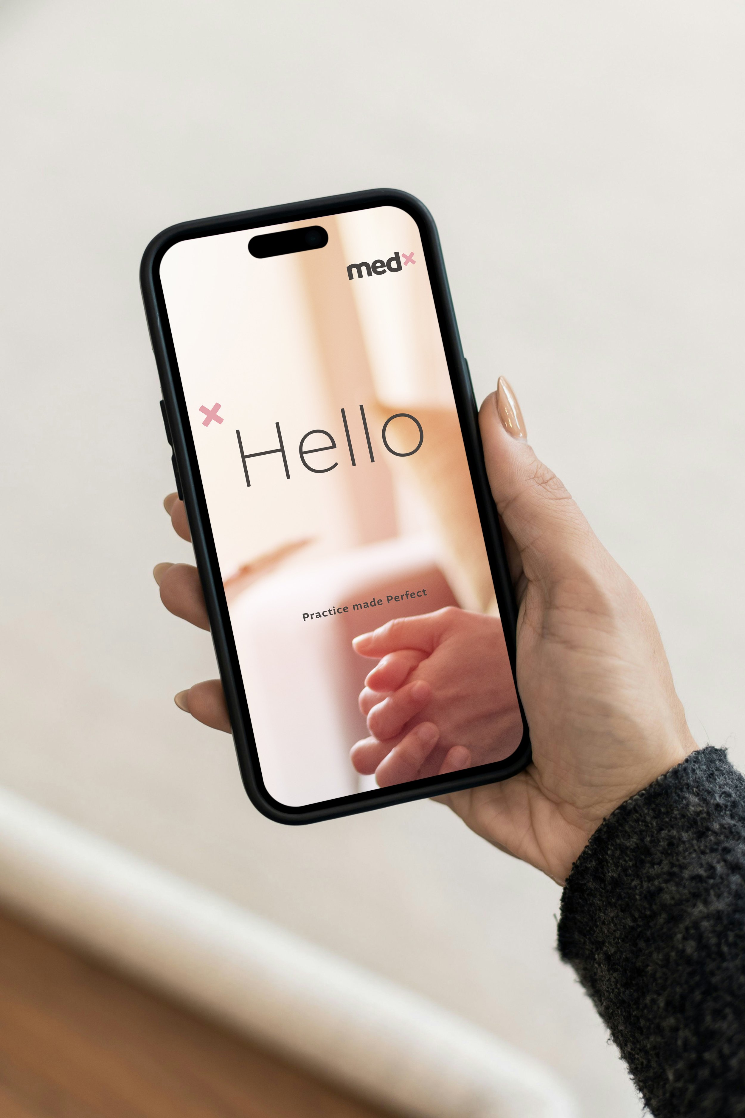 Lady holding mobile phone browsing the MedX online app welcome screen.