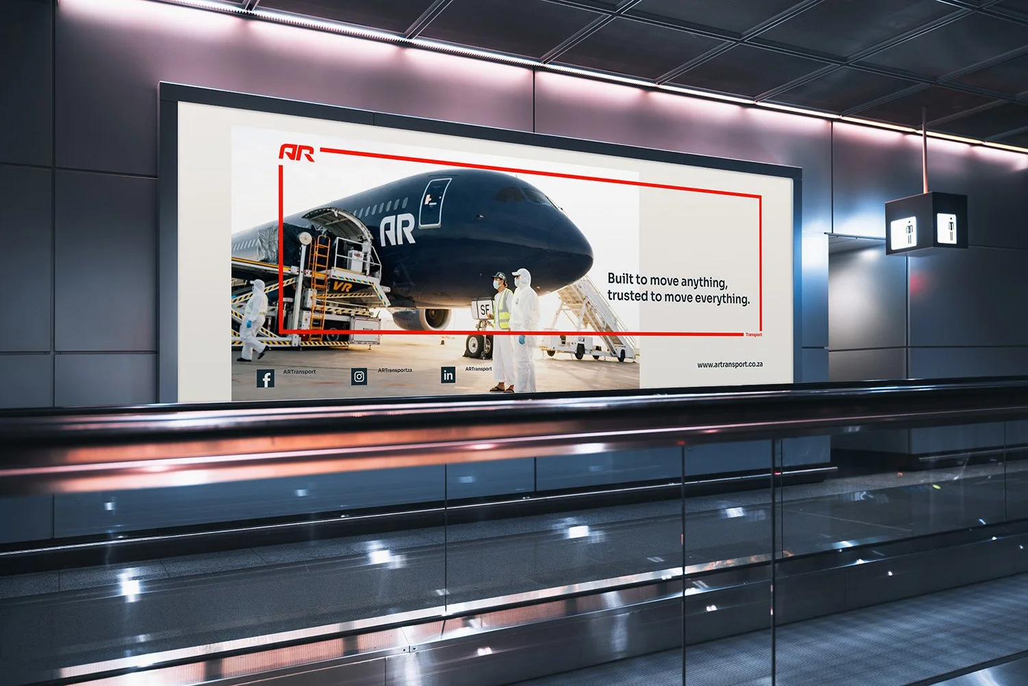 An airport advertisement featuring a large black airplane with the logo 'AR' on the nose, surrounded by ground staff and equipment. The ad has text saying 'Built to move anything, trusted to move everything,' and includes social media icons and a website link.