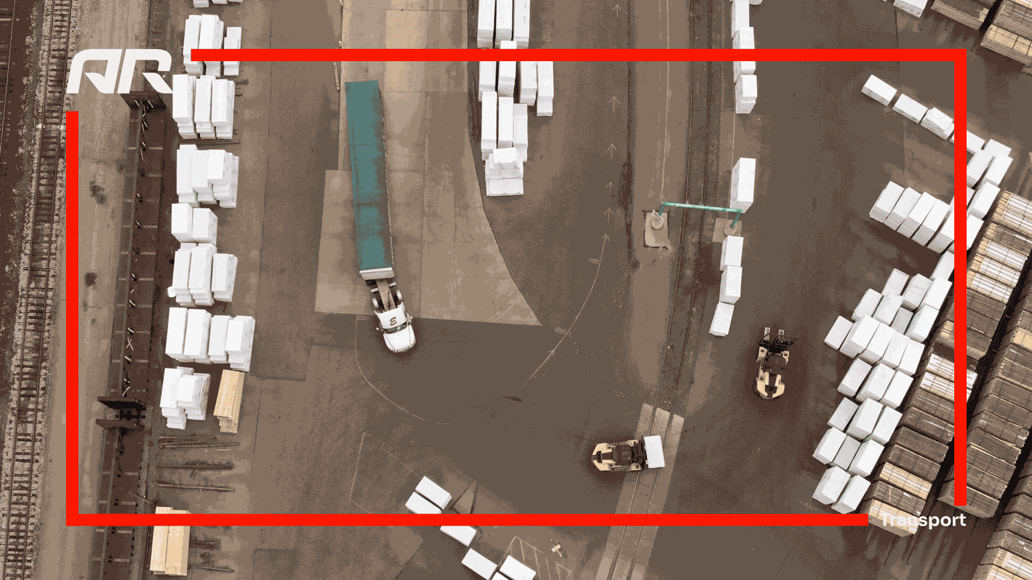 An aerial view of a warehouse or shipping yard featuring white and brown crates, two forklifts, and a delivery truck with a blue tarp.