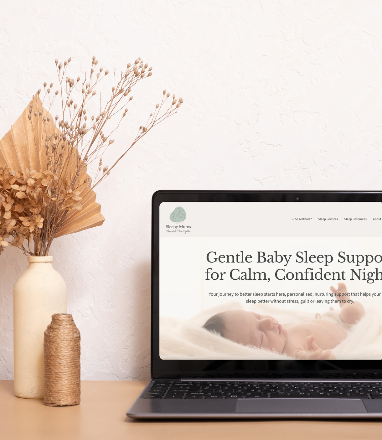 A laptop showing a high-end, responsive website redesign for a Sleepy Mums Holistic Sleep Consultant Business in Vale of Glamorgan
