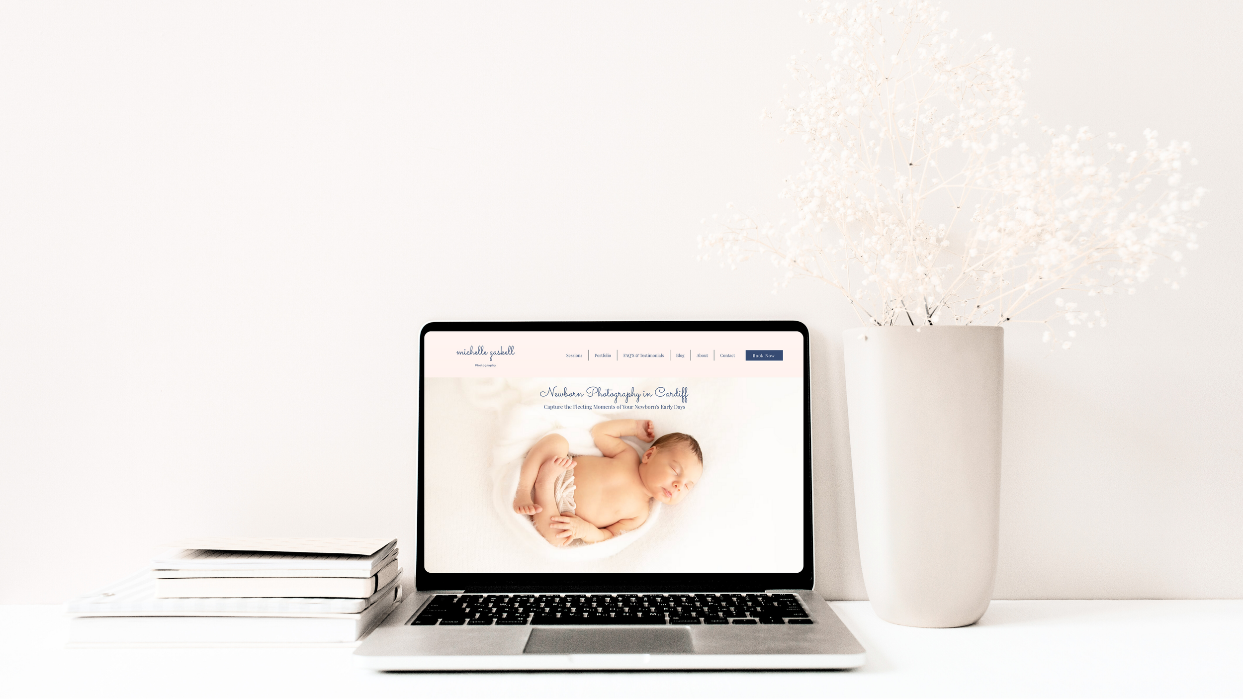 A laptop showing a high-end, responsive website redesign for Michelle Gaskell Newborn and Family Photographer in Cardiff