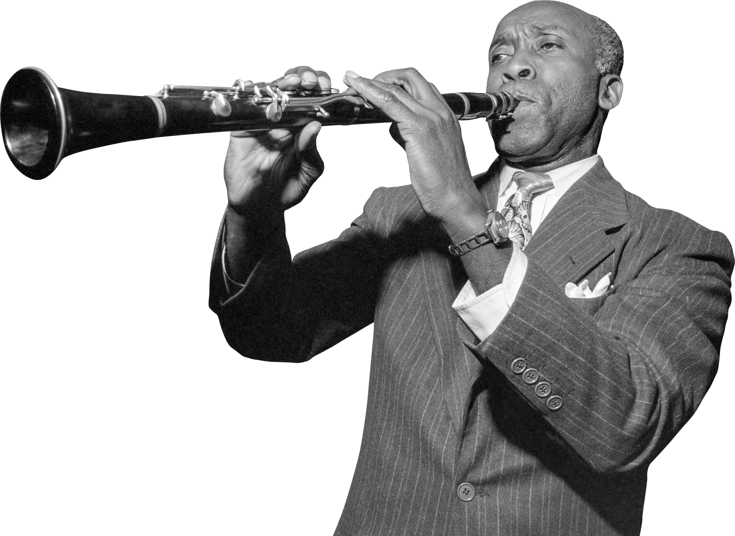 A black and white photograph of a man in a suit playing a clarinet.