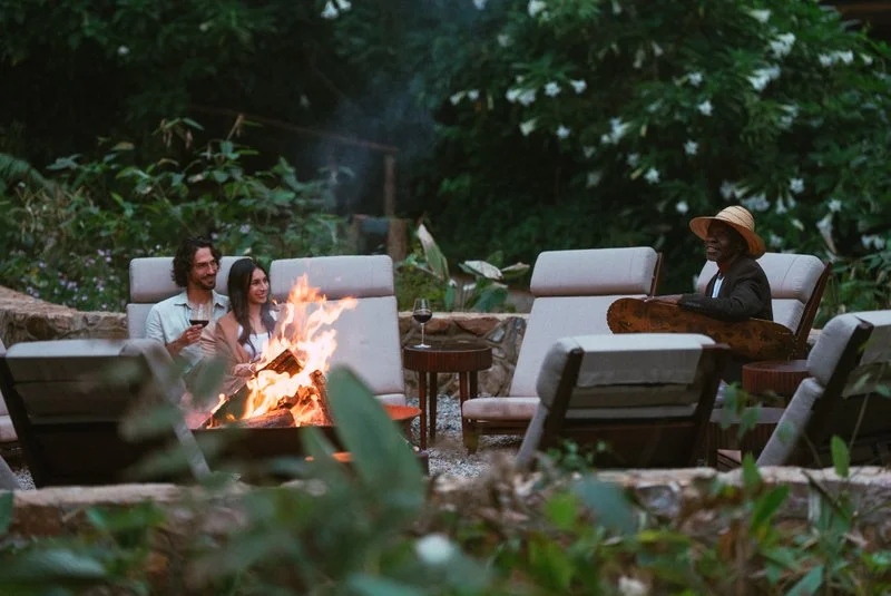 Guests Sitting Around the Lodge Fire, Virunga Massif, Uganda