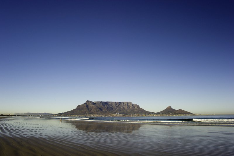 View of Table Mountain from the ocean on a clear morning in Cape Town, South Africa
