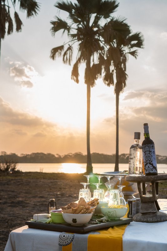 Sundowners at sunset in Liwonde National Park, Malawi