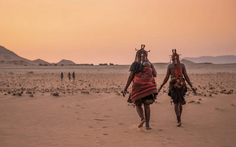 Himba Walking at Sunset, Namibia
