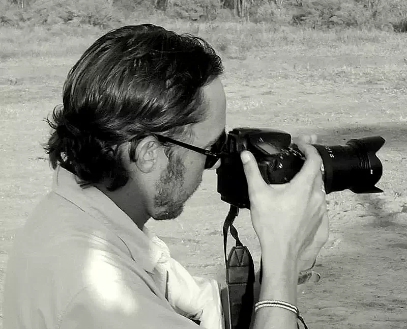 Professional photographer Isbjorn “Okaroo” waiting patiently behind his camera for the ideal shot