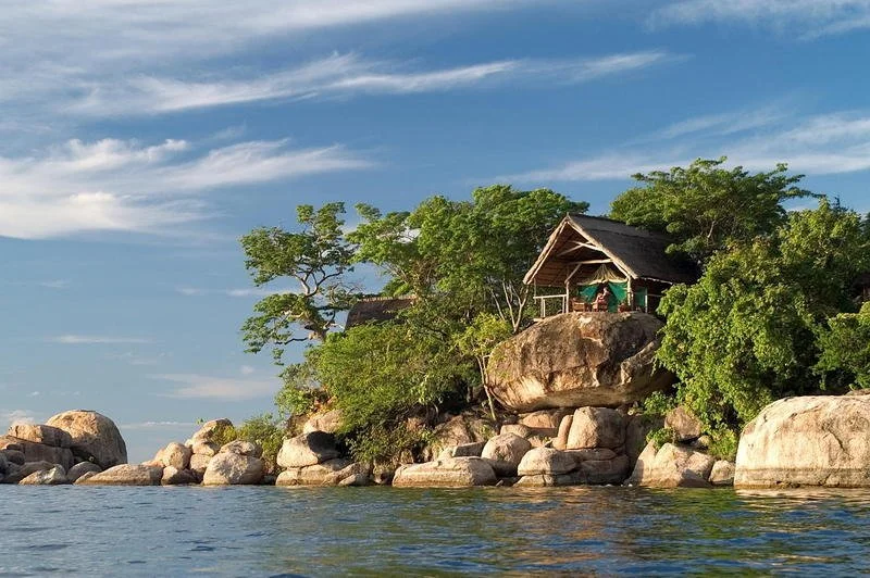 Remote lodge perched atop a boulder on an island in Lake Malawi National Park, Malawi.