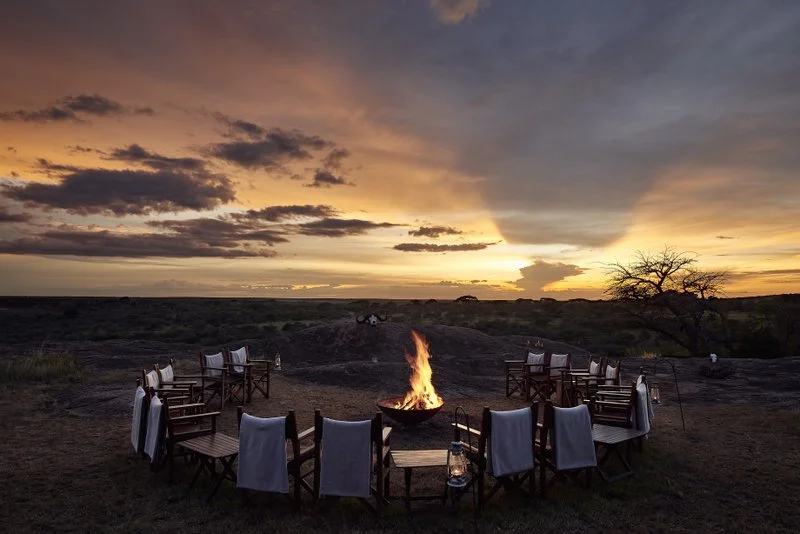 Evening campfire on a boulder overlooking the South Serengeti, Tanzania