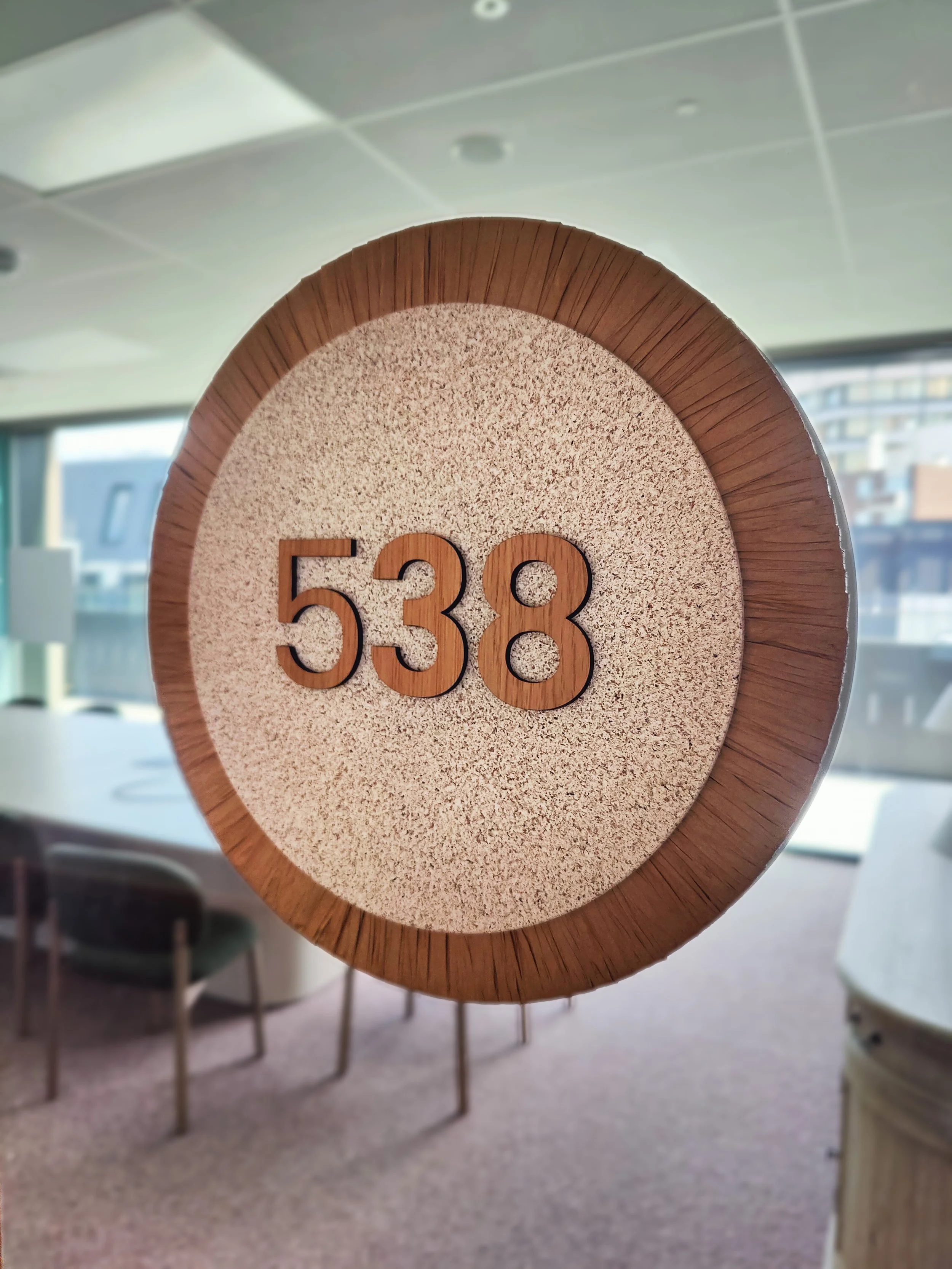 rafia wrapped sandstone coloured door sign