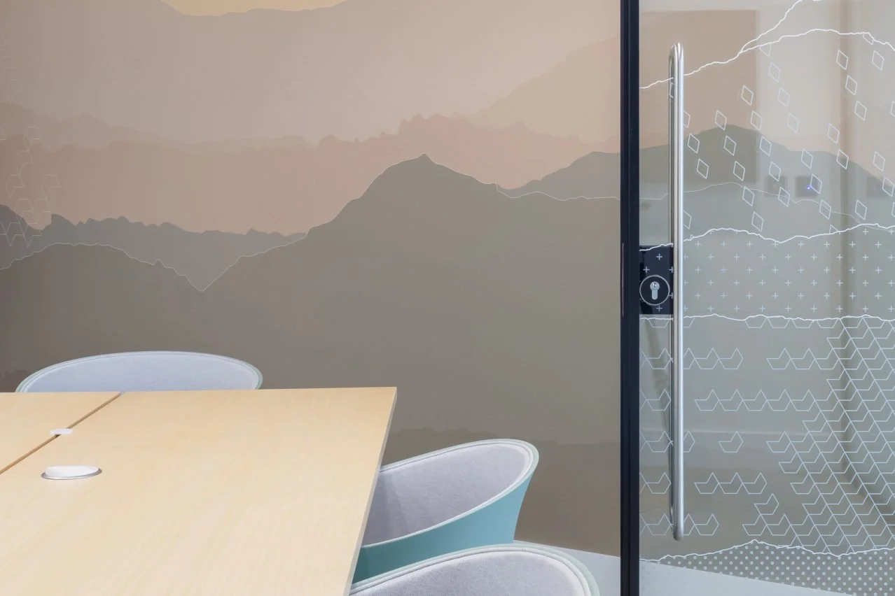 glass and wall manifestations in office meeting room, mountain themed