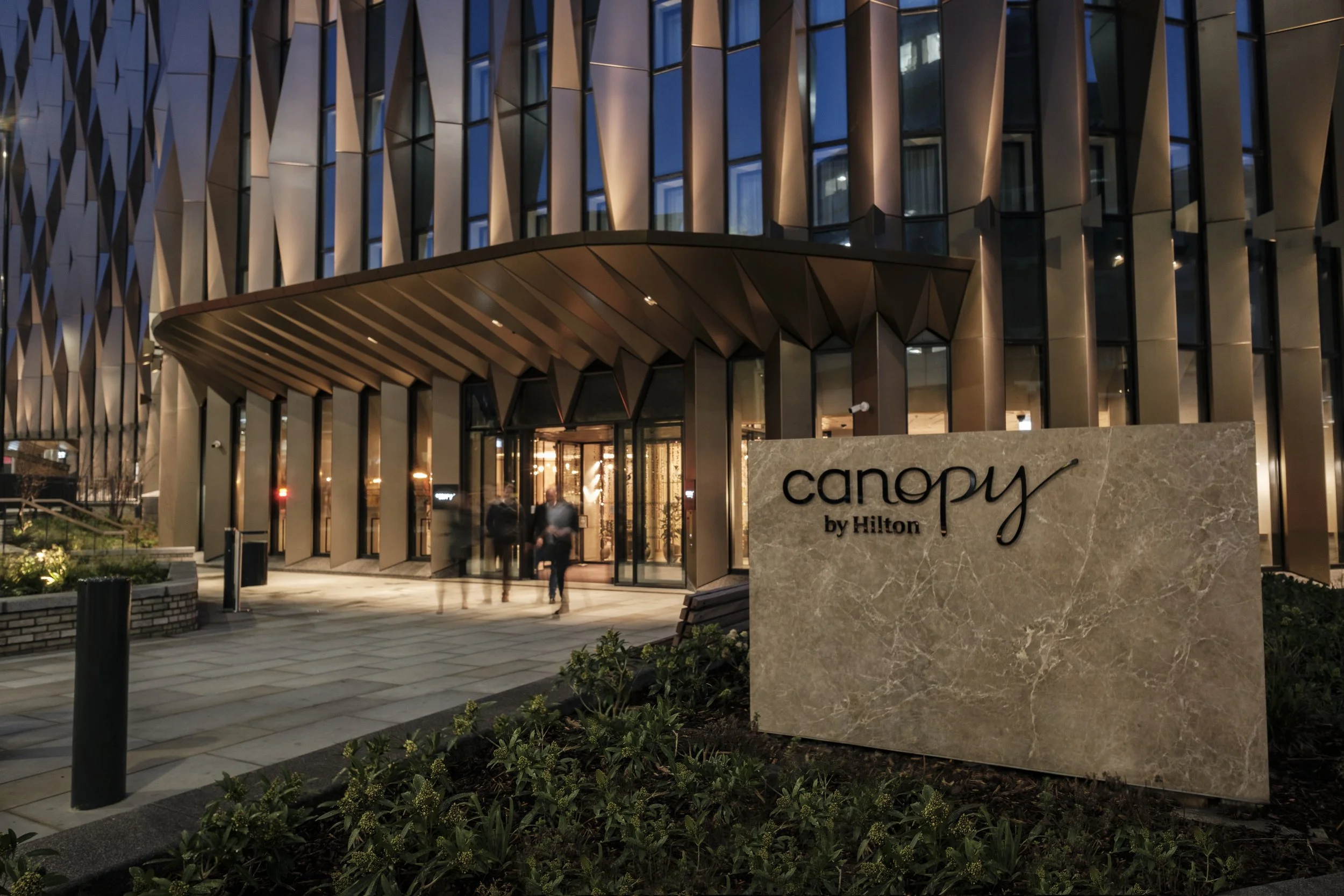 Canopy by Hilton exterior signage and hotel view