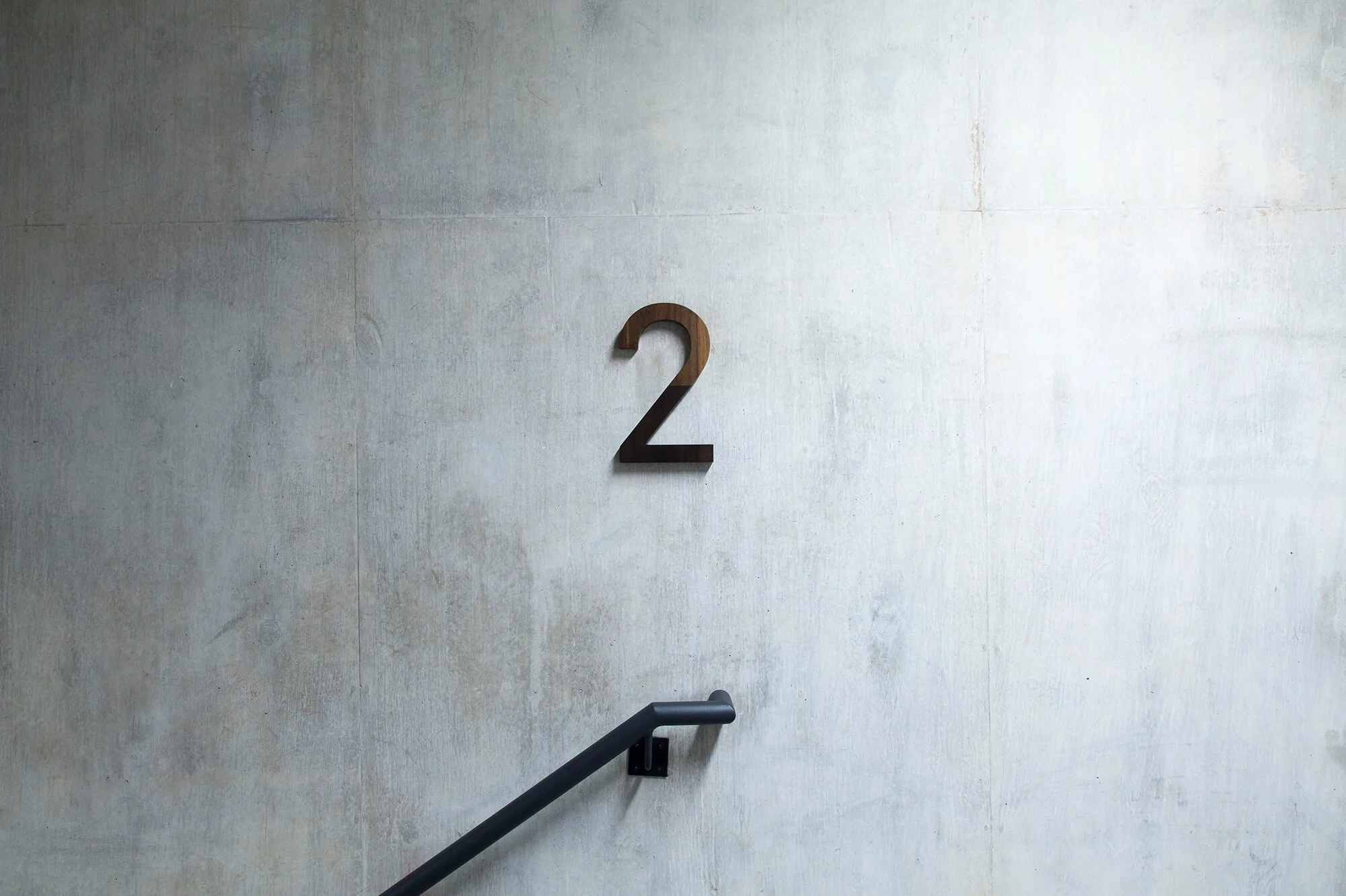 Three dimensional wooden lettering in stairwell