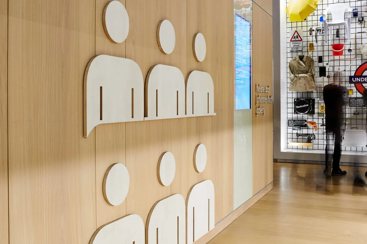 Custom people icons on light oak panel