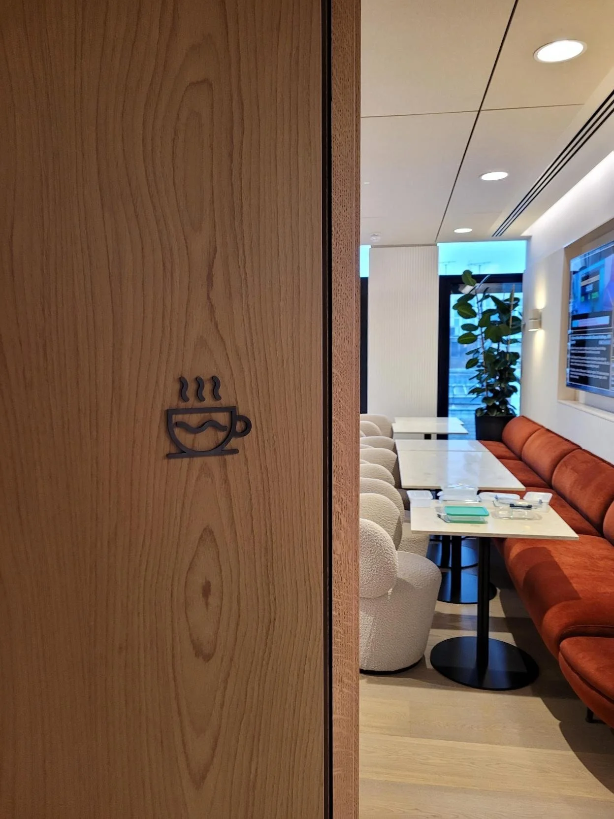 Café icon on wooden door