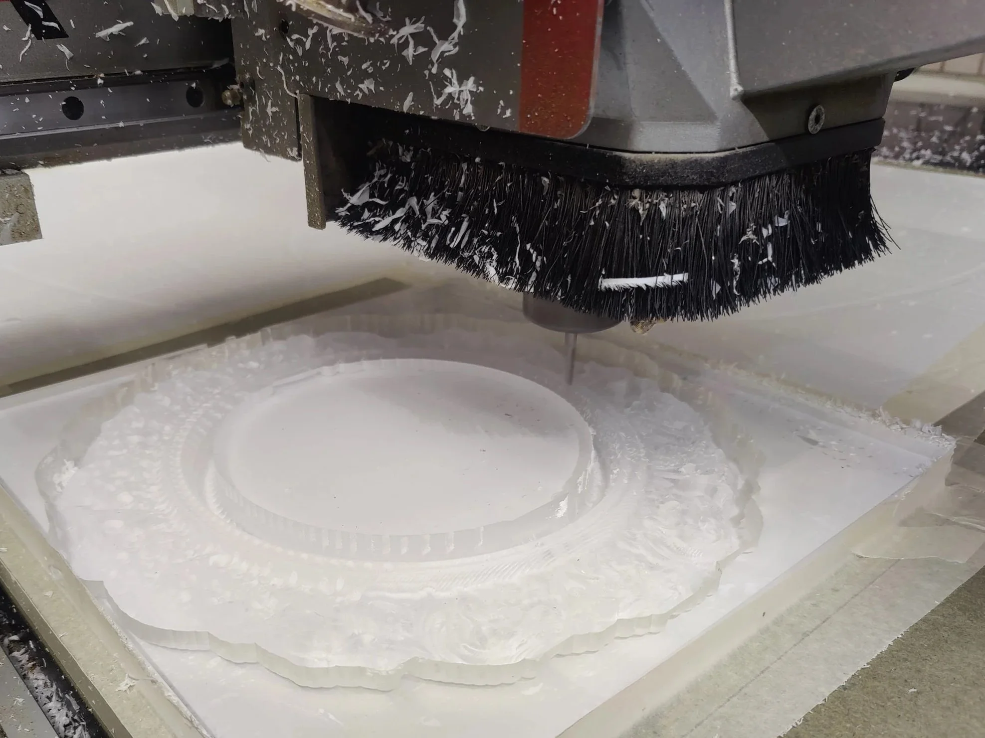 CNC cutting of white acrylic
