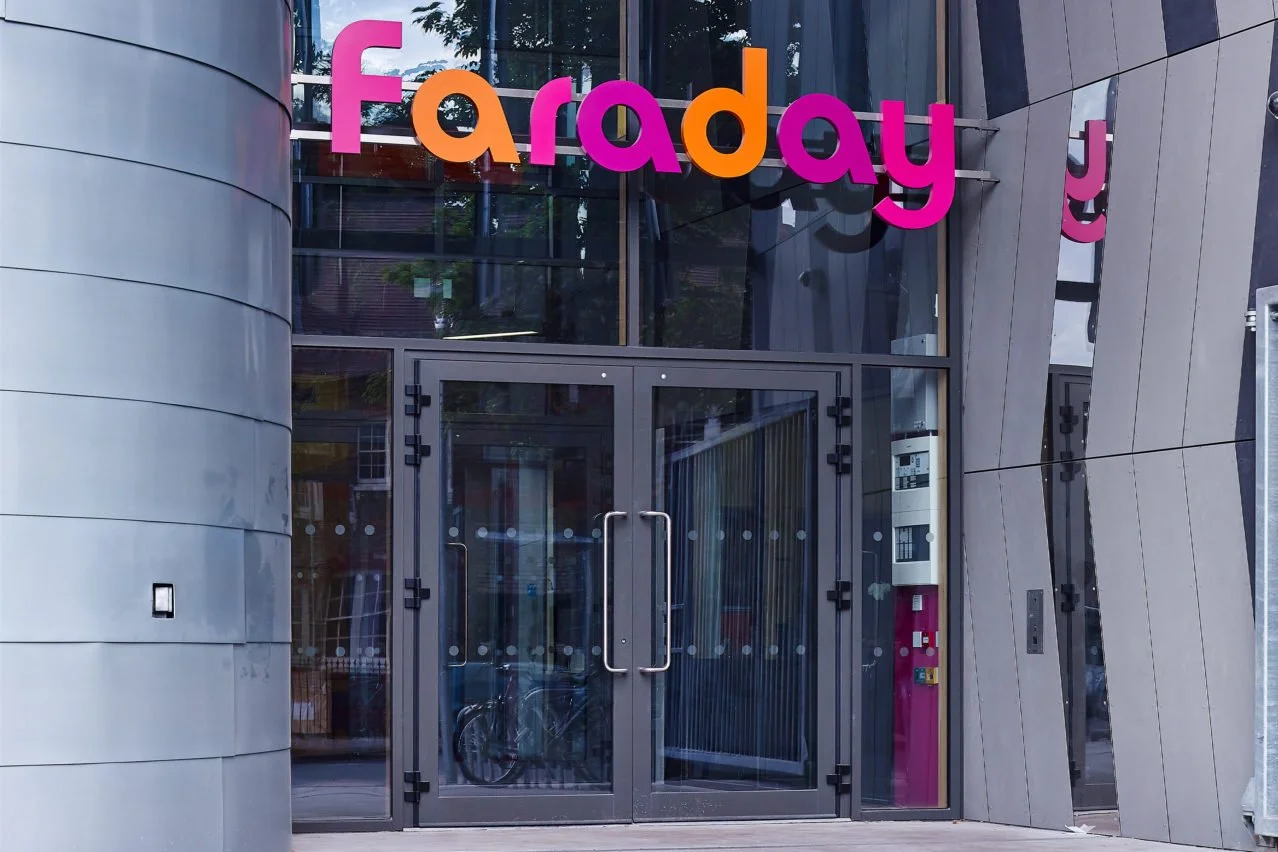 Exterior signage at Michael Faraday school