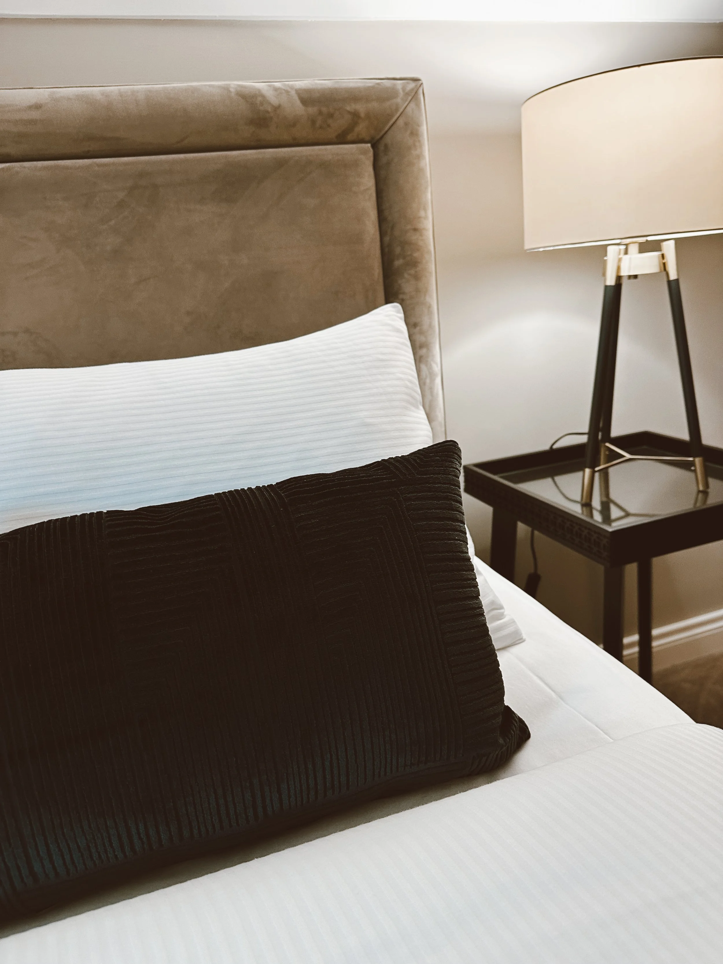 Bedroom bed side table and pillows at Maine House Galgorm in Galgorm Ballymena 