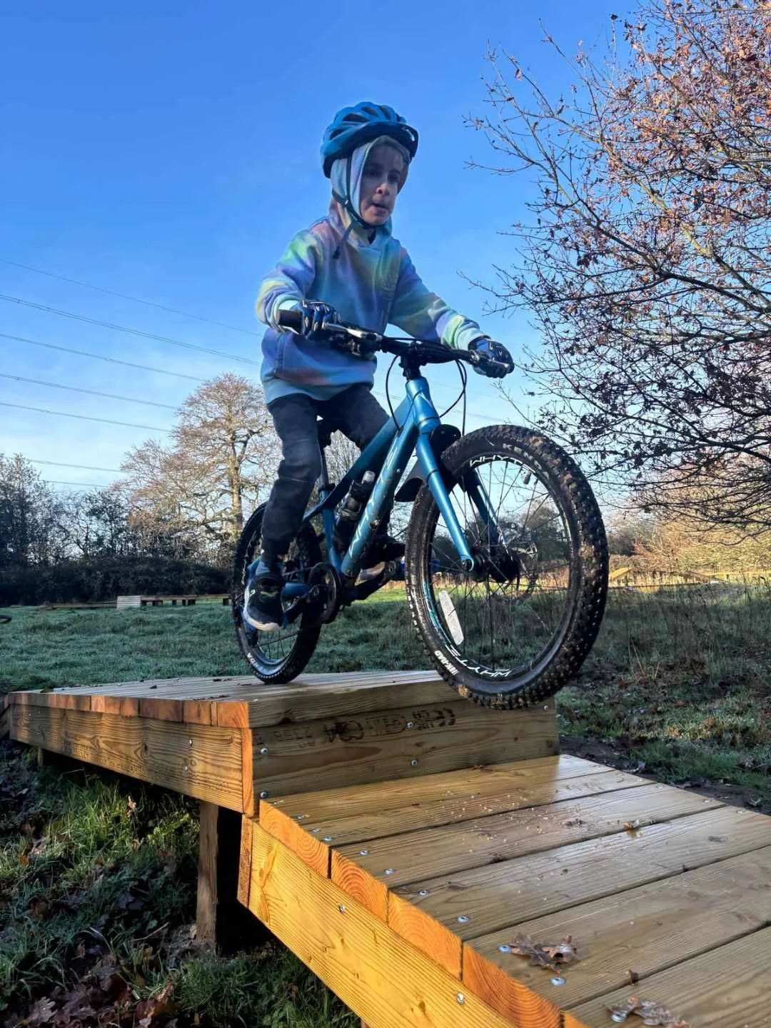 A child riding a mountain bike at a Muddy MTB Session in Amersham, Bucks